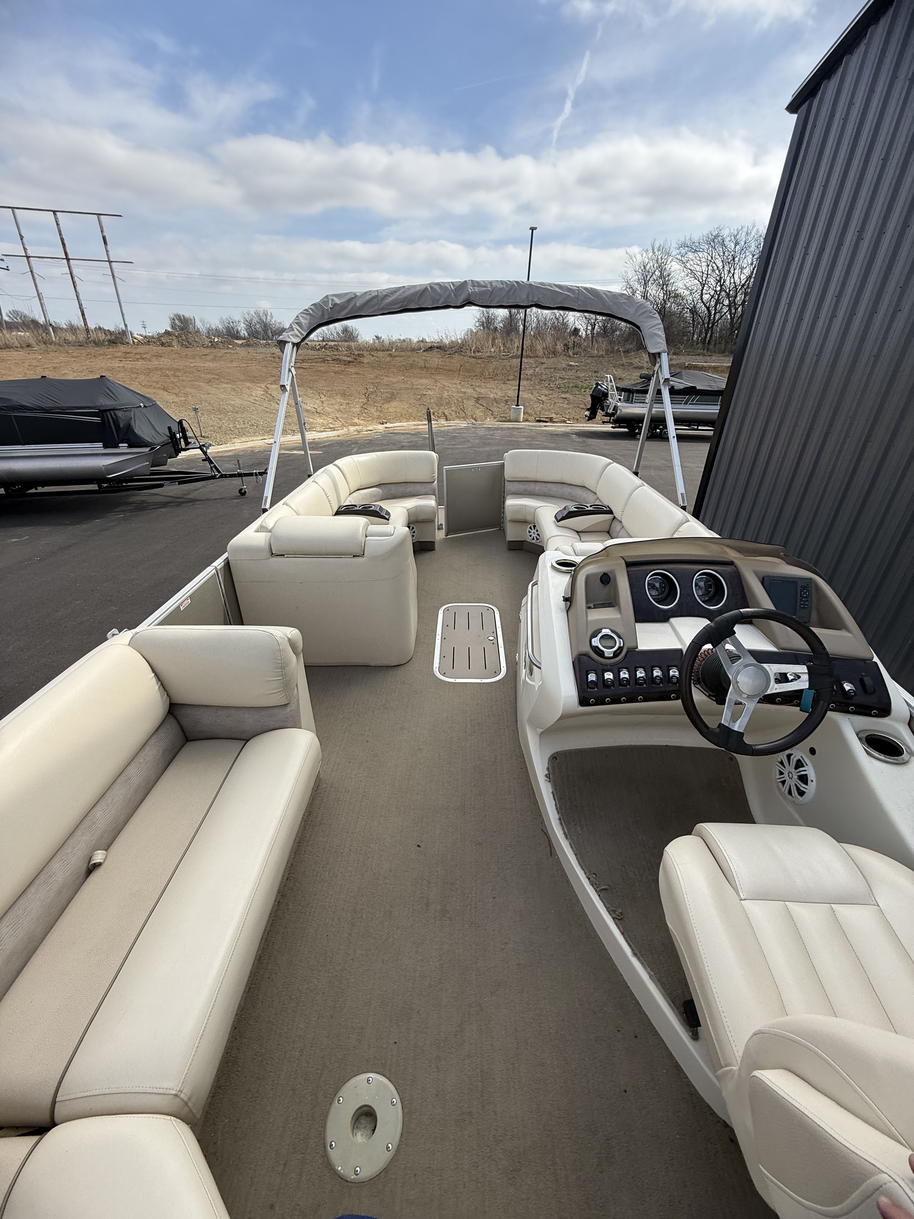 Interior view of a 2014 Bennington 2575RCW-I/O pontoon boat.