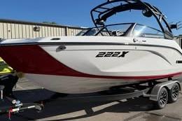 2026 Yamaha Boats 222XD on trailer, white and red design, parked outdoors.