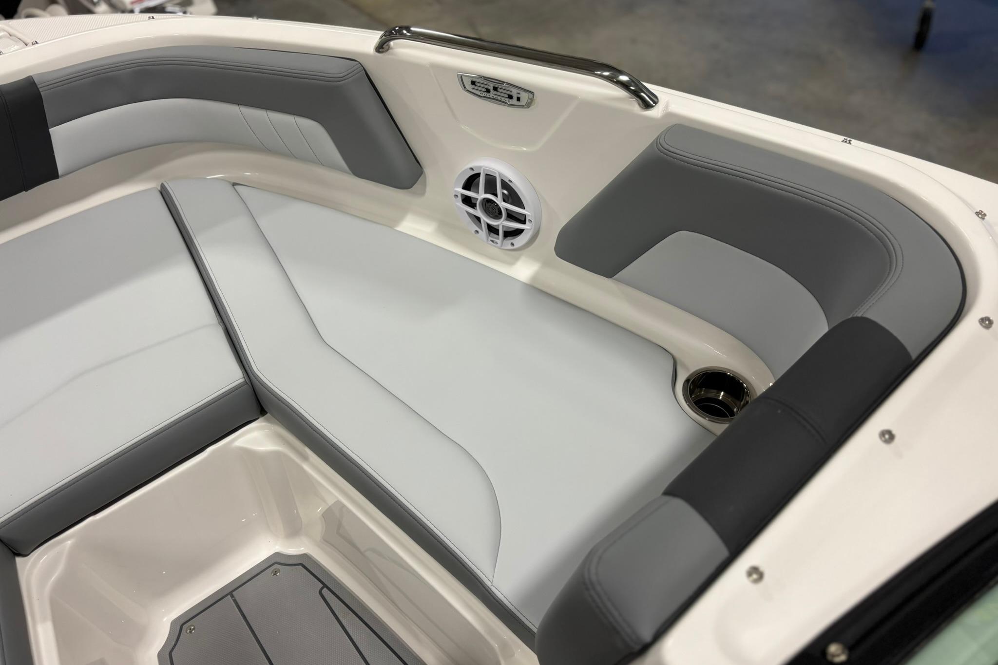 2026 Chaparral 21 SSi OB boat interior with gray seating and speaker.