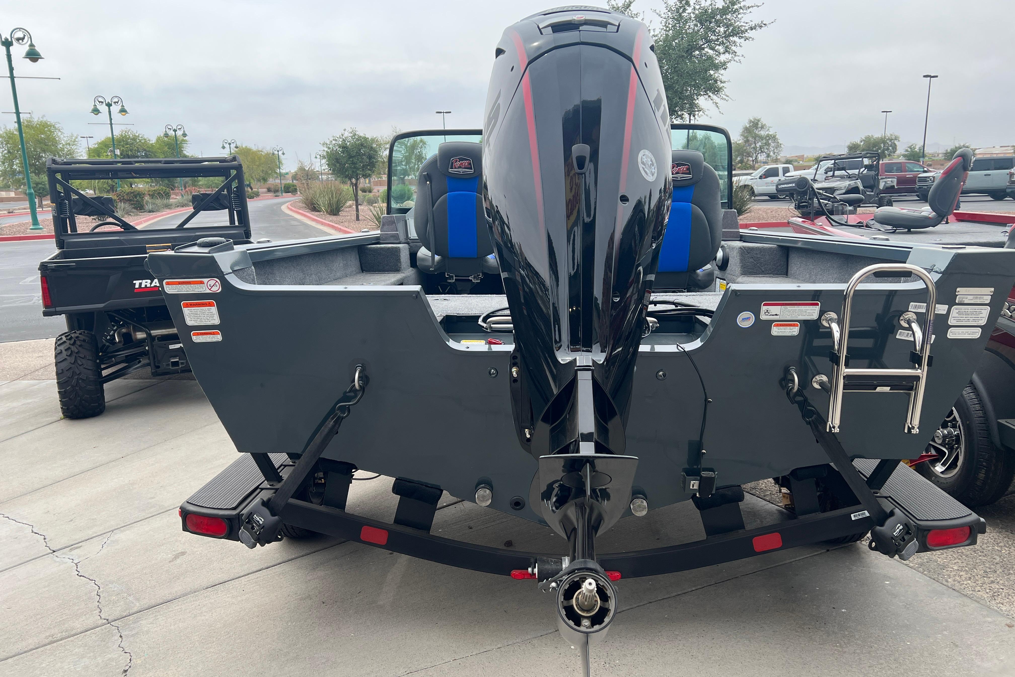 2026 Ranger VS1682SC Angler boat with powerful outboard motor, parked on a trailer.