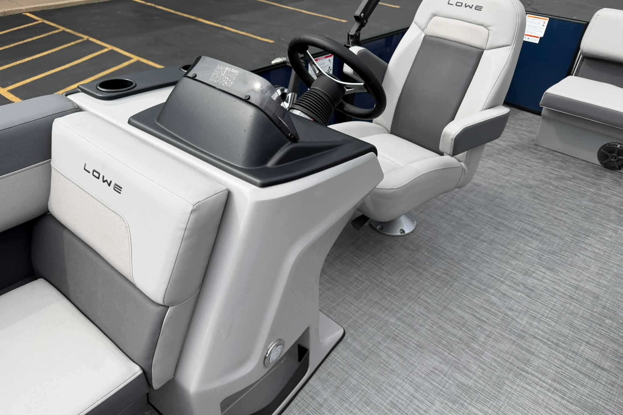 Interior of 2026 Lowe LS 190 boat featuring modern seating and steering console.
