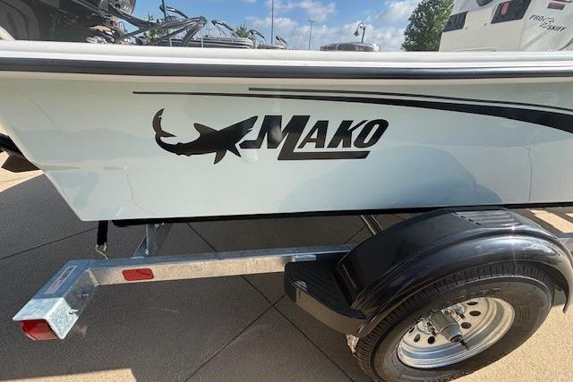 2026 Mako Pro Skiff 15 CC boat on trailer, featuring shark logo.