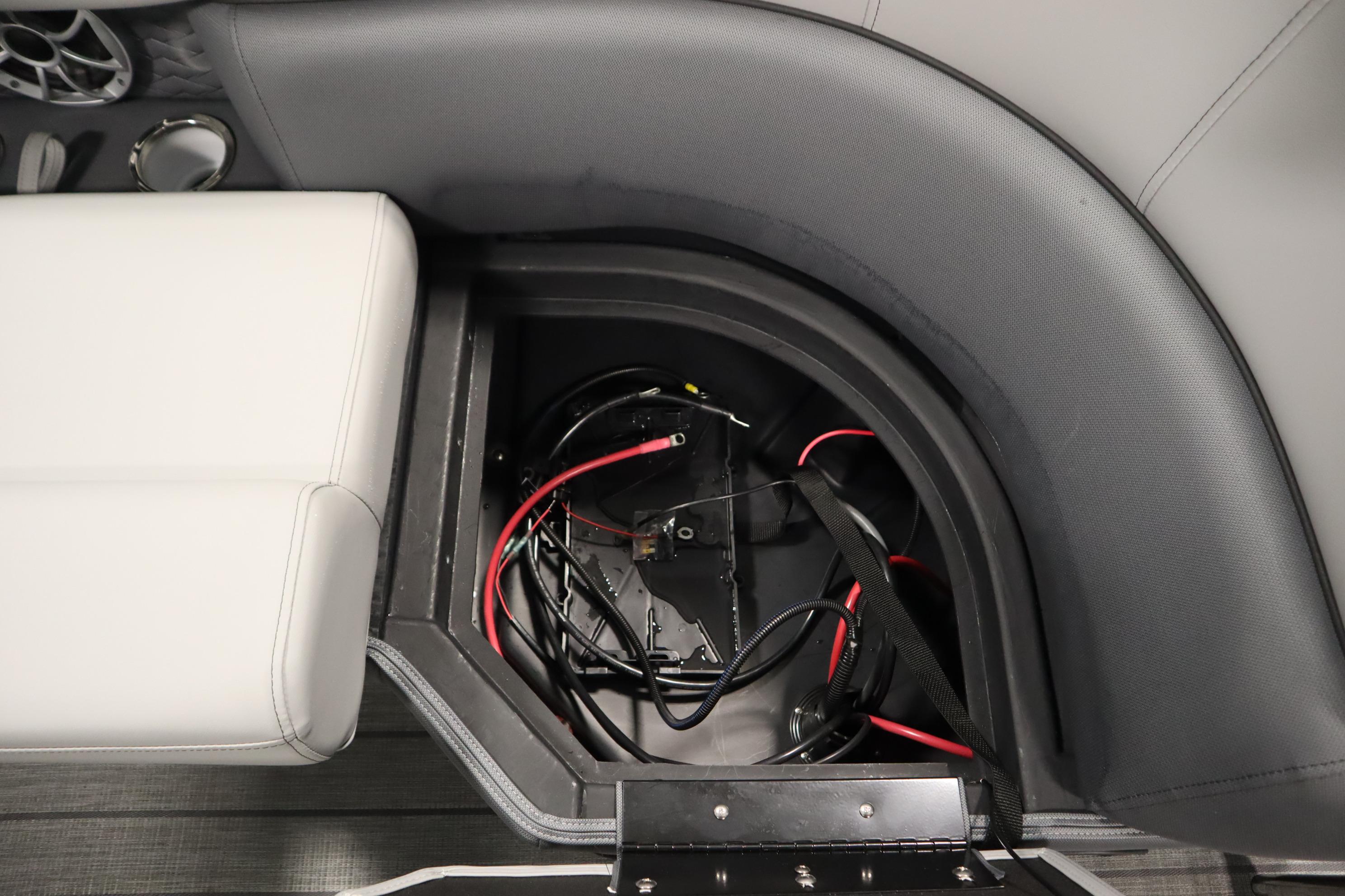 2025 Bentley Pontoons Elite 253 Admiral Tri-toon storage compartment with wiring and seating.