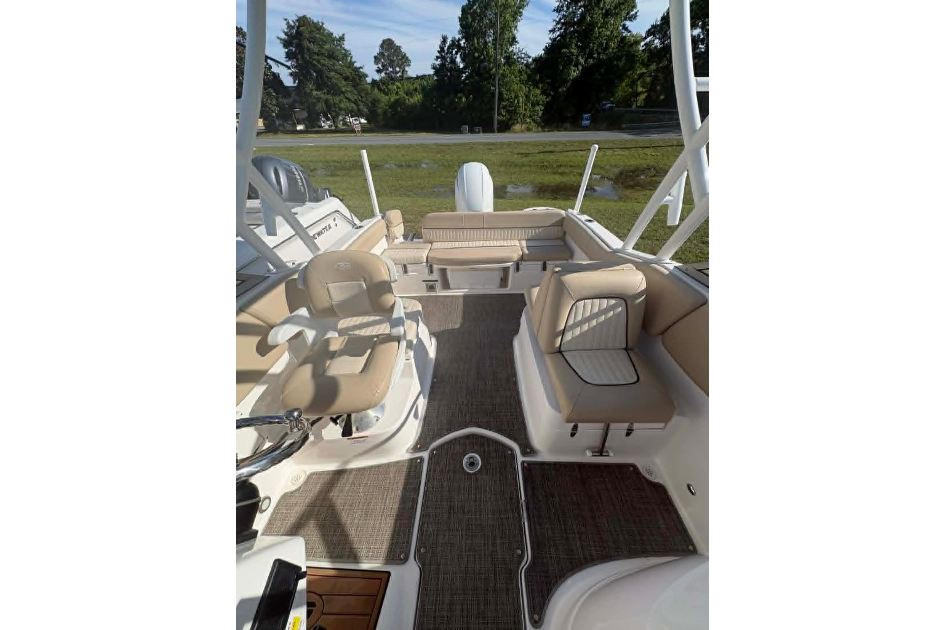 2019 Sea Fox 226 Traveler boat interior with beige seating and spacious layout.