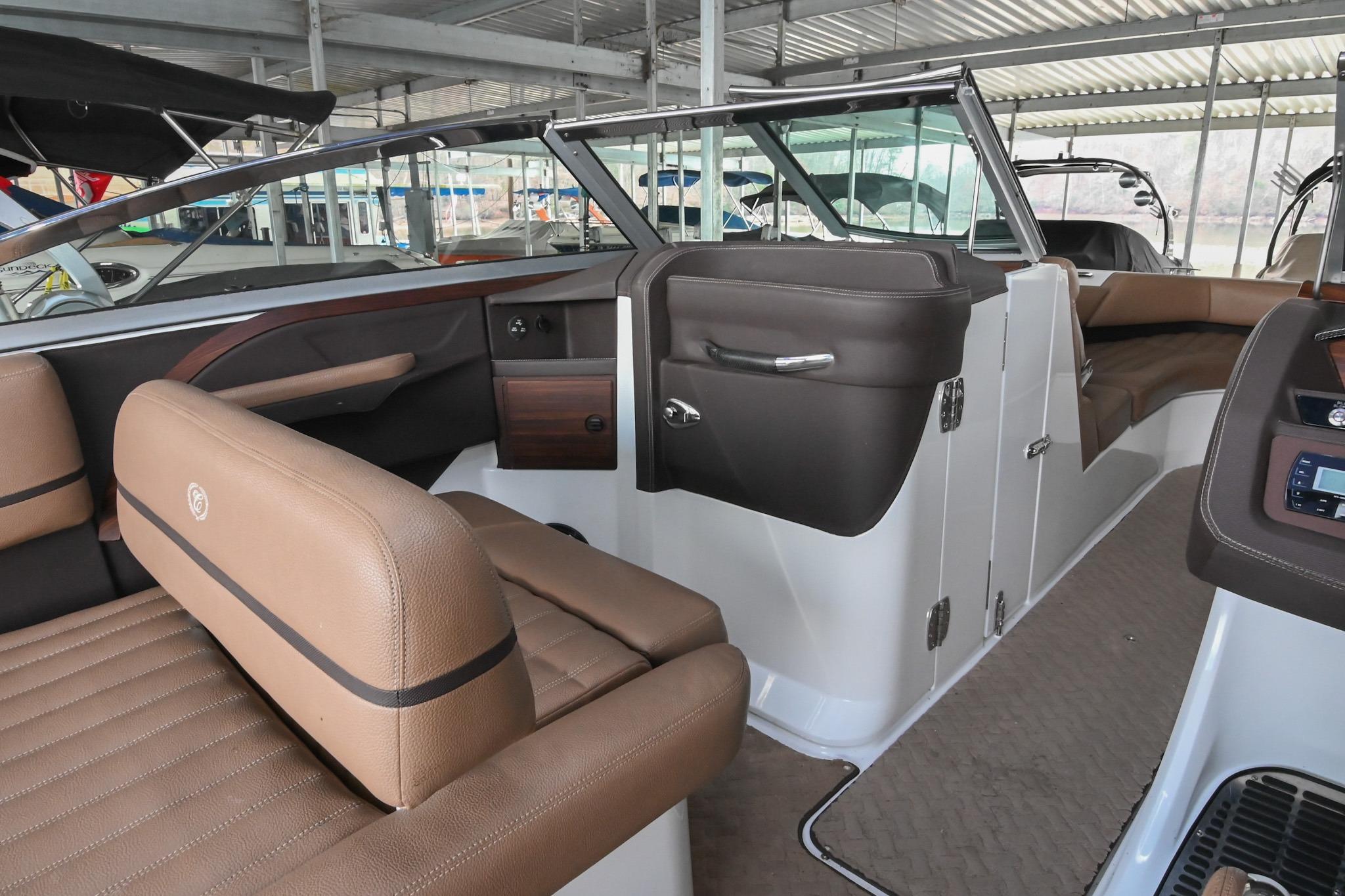 2015 Cobalt R7 boat interior with brown leather seating and modern dashboard.