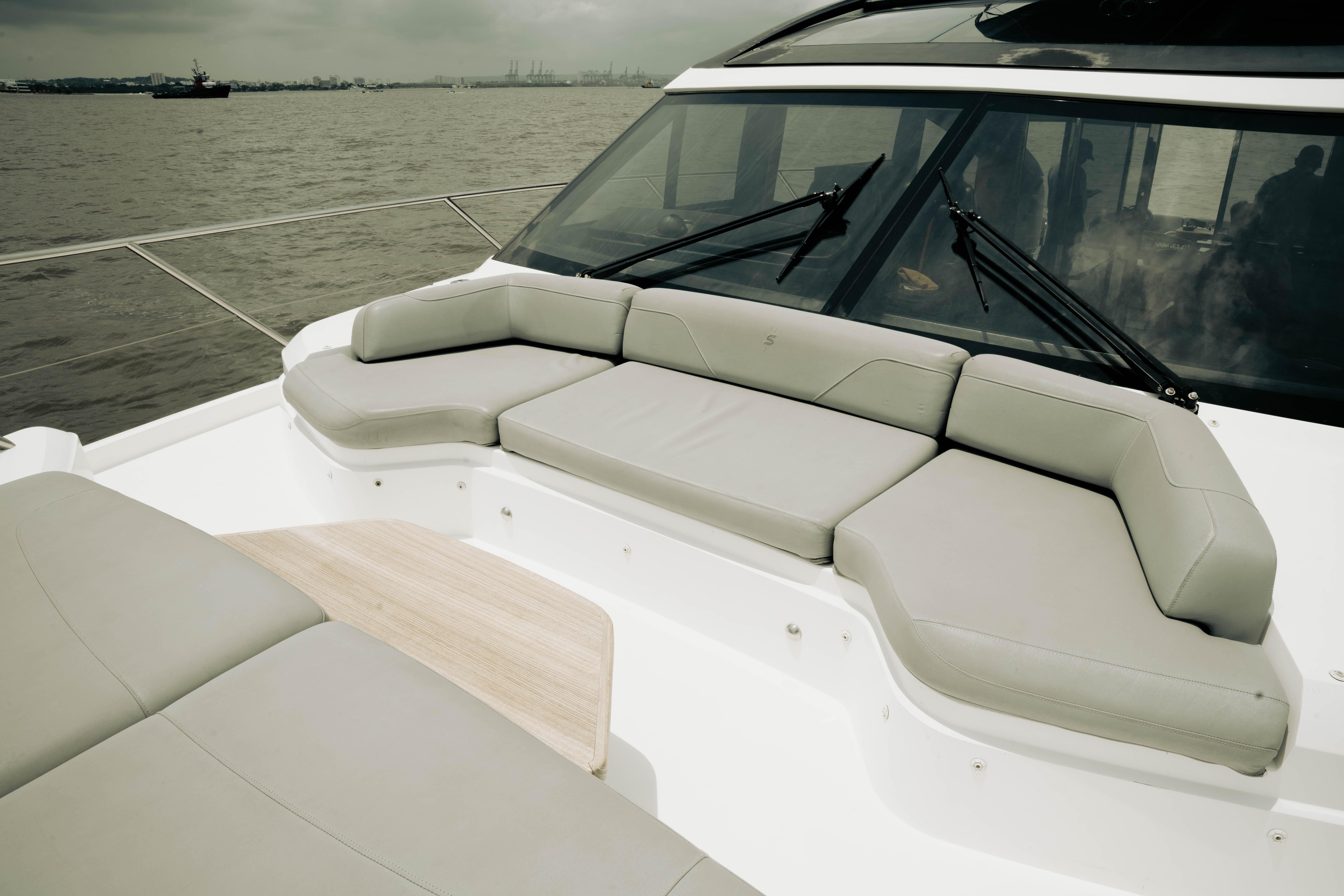 Luxurious seating area on 2020 Princess S62 yacht, overlooking calm waters.