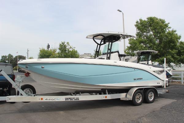 2023 Scarab 255 Open ID boat on trailer, light blue and white design.