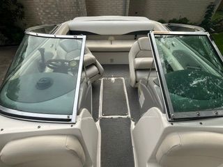 Interior view of a Chaparral 190 SSi boat with white seating and split windshield design.