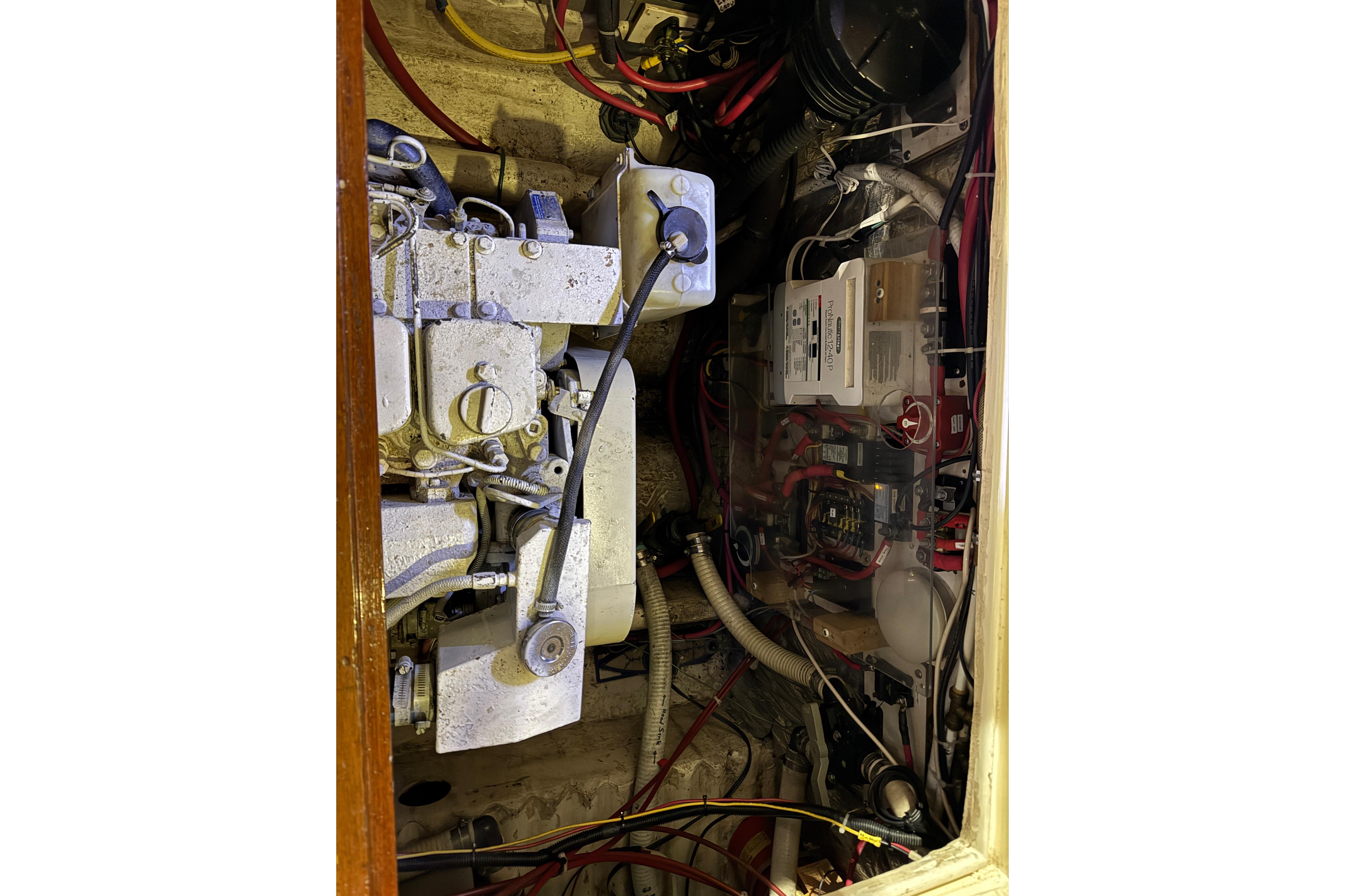 Engine compartment of a 1988 Blue Seas 31 boat, showing mechanical and electrical components.