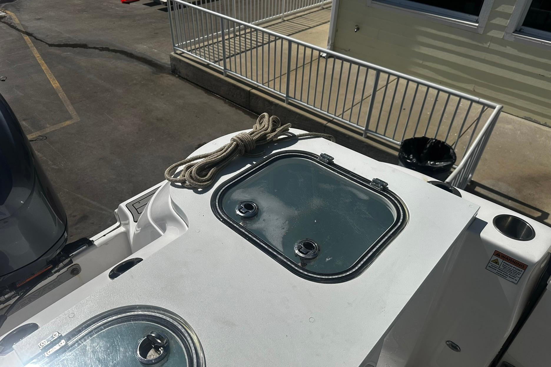 Sea Fox 228 Commander boat deck with rope and hatch, 2002 model.