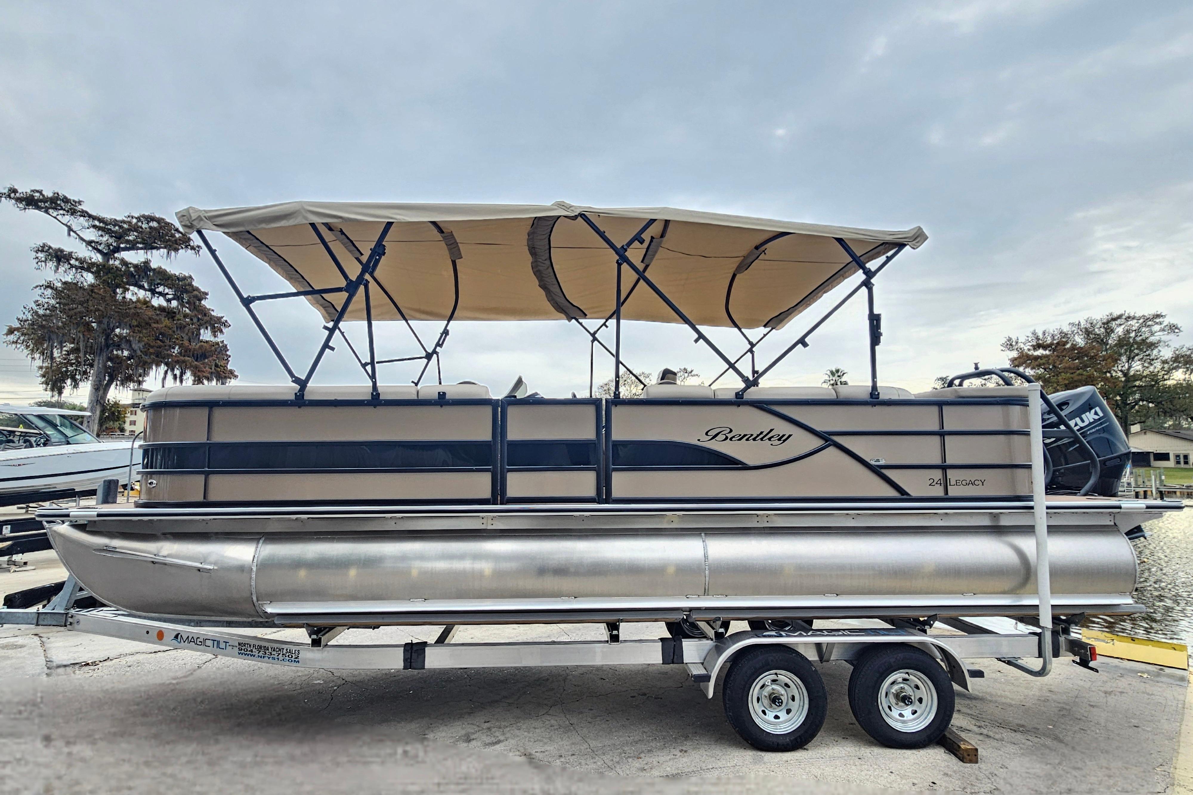 2026 Bentley Pontoons Legacy 243 Cruise on trailer, featuring canopy and sleek design.