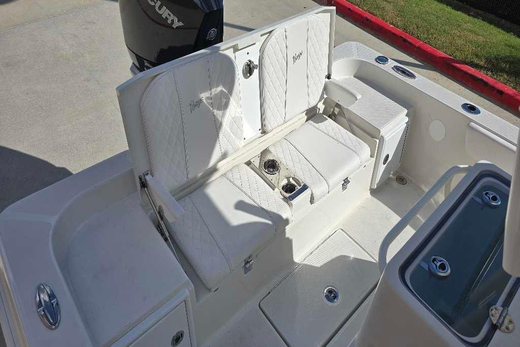 2025 Ranger 2360 Bay boat interior with white seating and storage compartments.