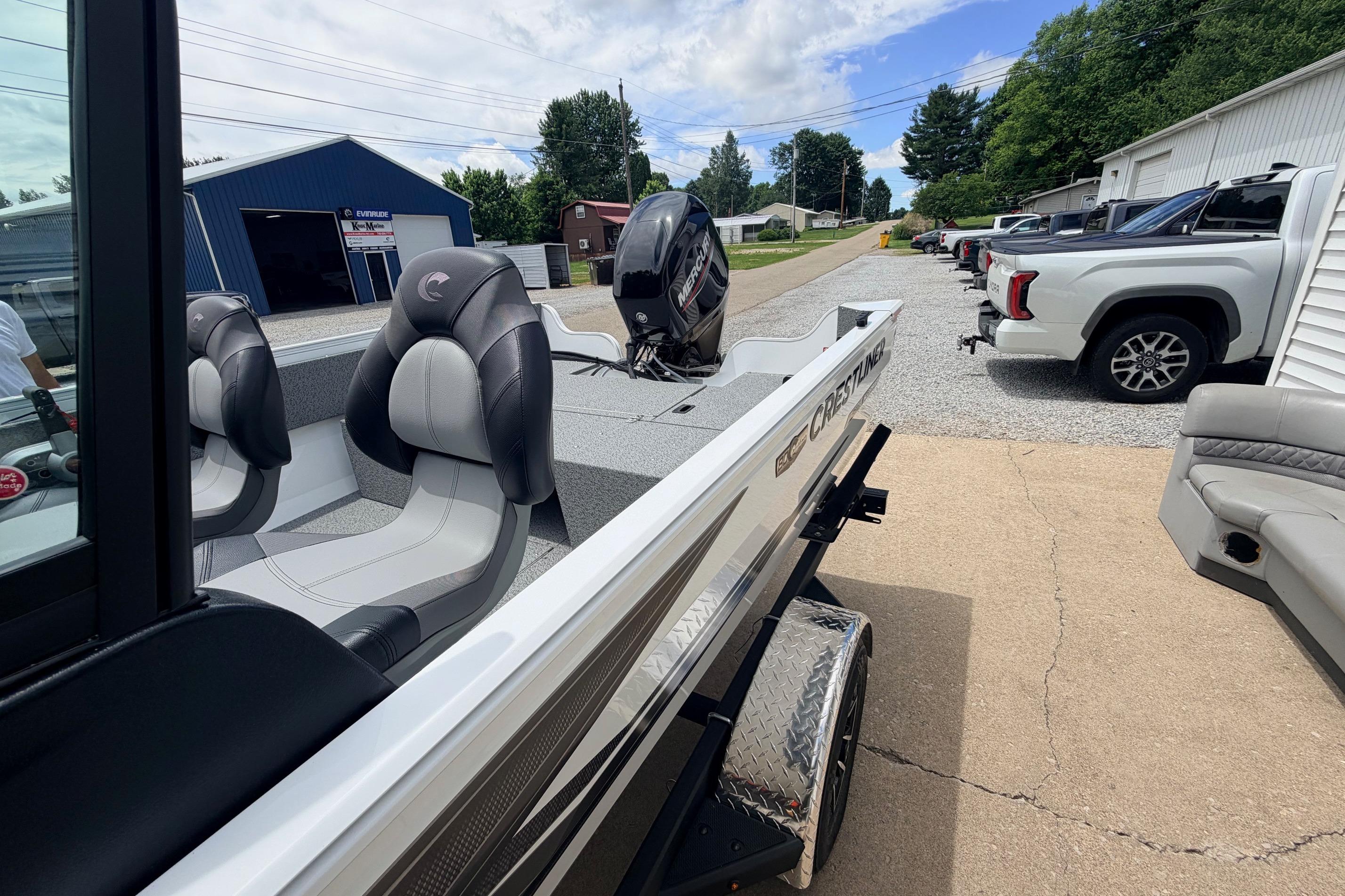 2026 Crestliner 1650 Kodiak WT boat with sleek seating and powerful outboard motor.