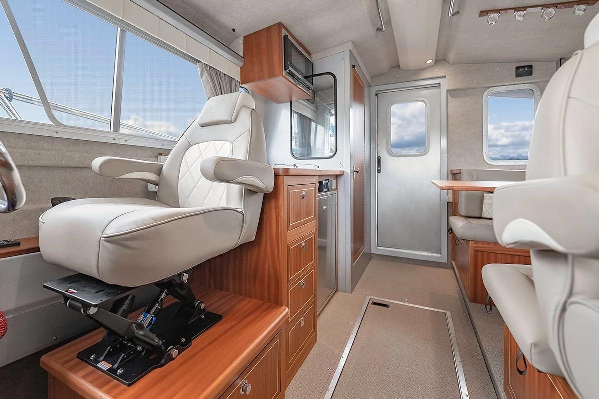 Luxurious interior of 2026 KingFisher 3225 GFX Offshore boat with plush seating and modern design.