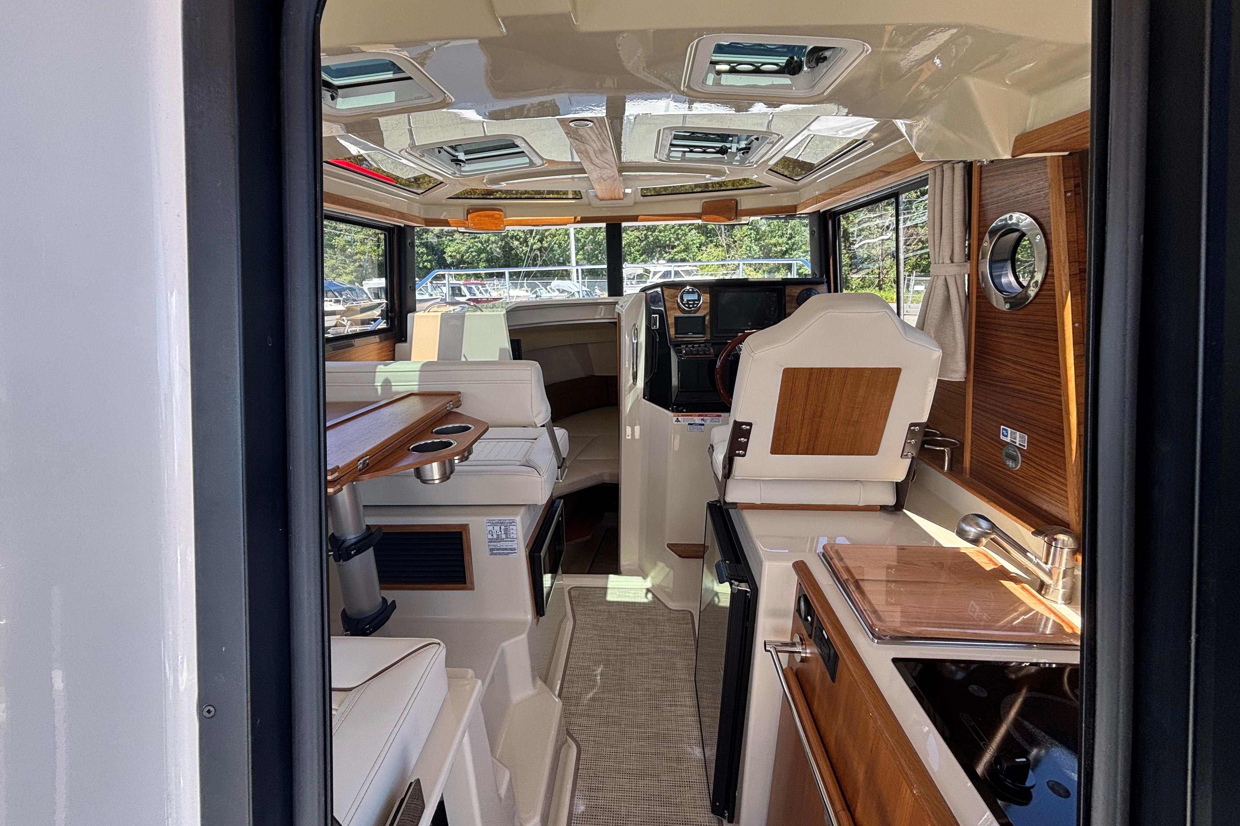 Interior of 2026 Ranger Tugs R-25 boat, featuring modern design and luxurious amenities.