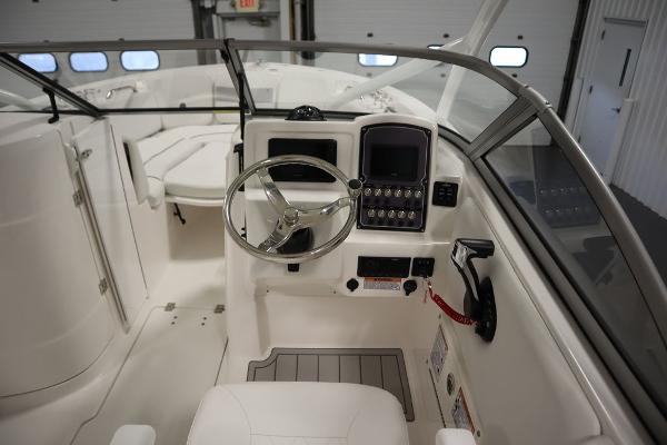 2025 Sea Fox 228 Traveler boat interior with steering wheel and control panel.