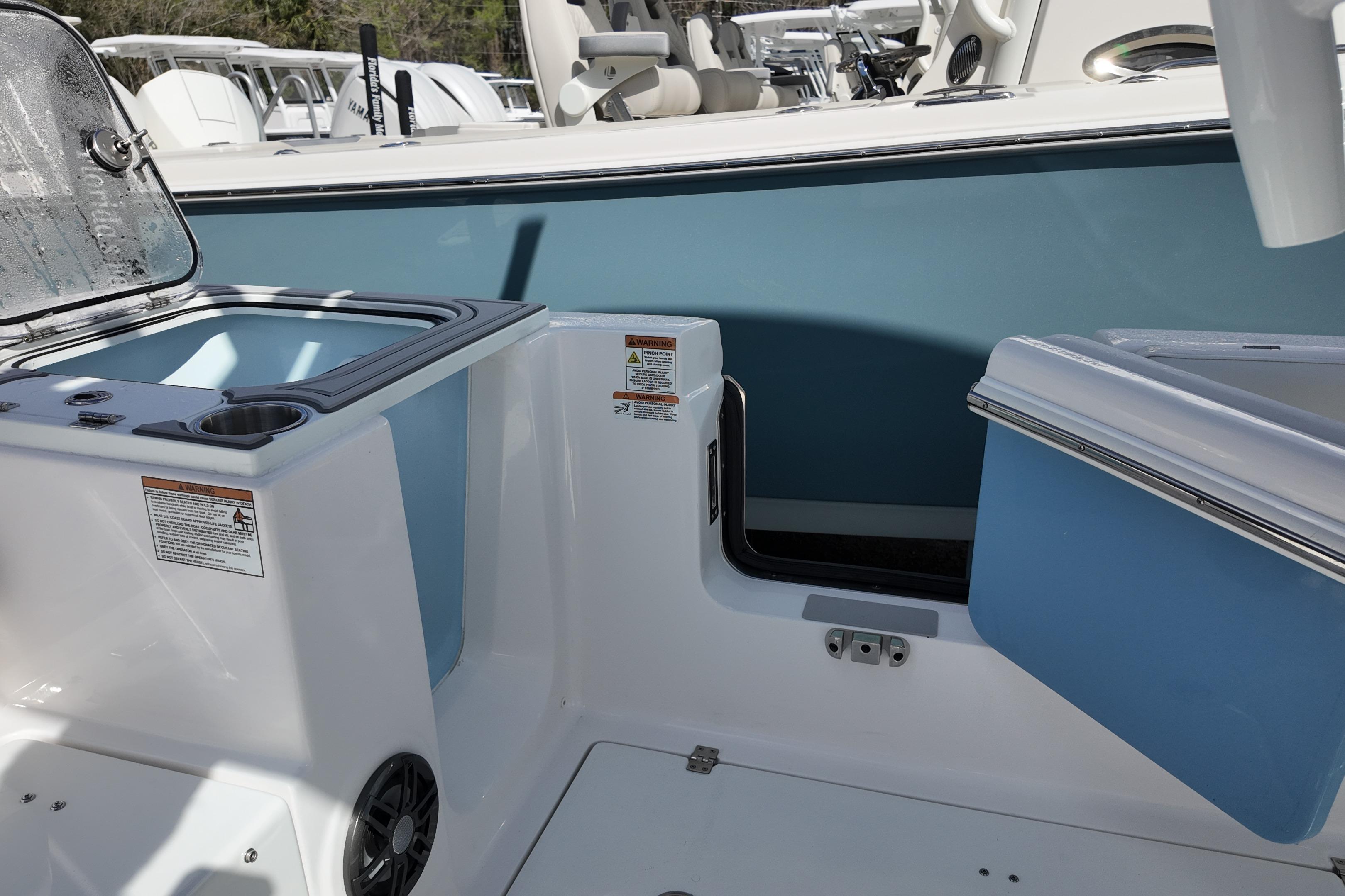 2026 Sea Fox 268 Commander boat interior with storage compartments and seating area.