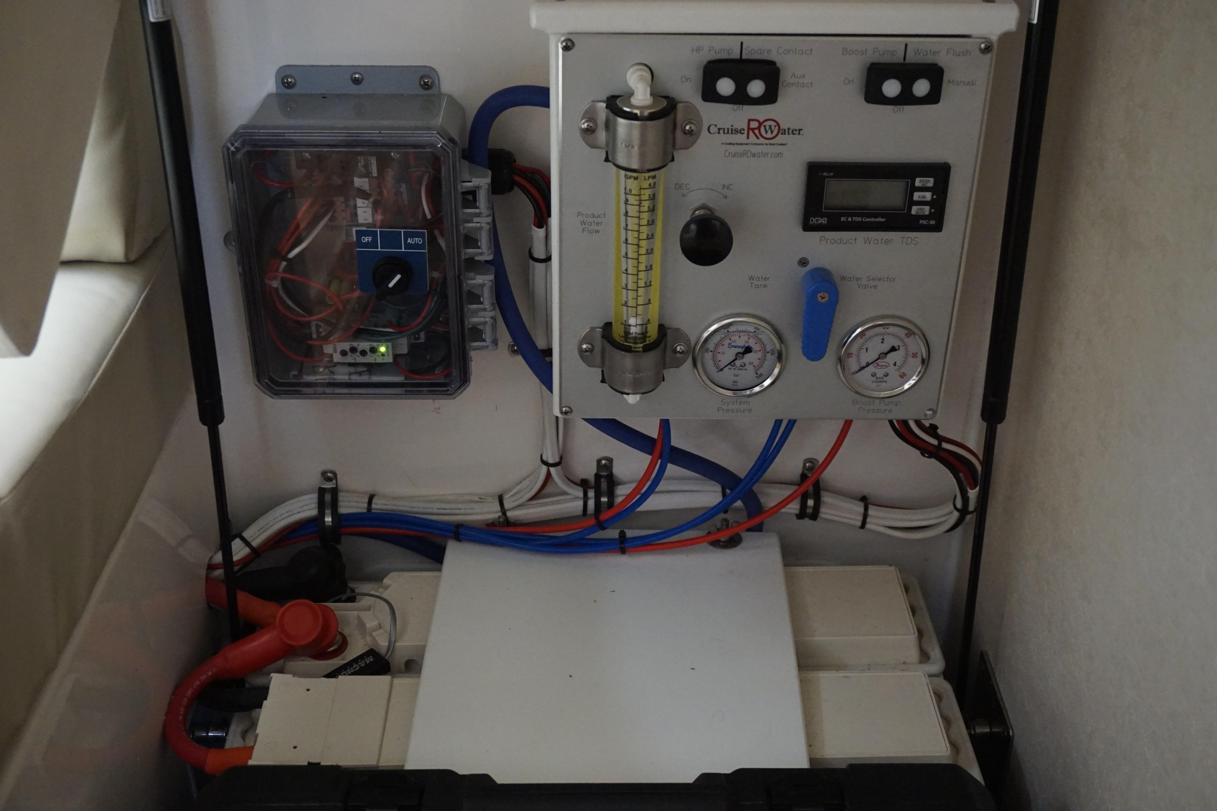 Control panel and wiring inside a 2005 Cabo 35 Express boat.