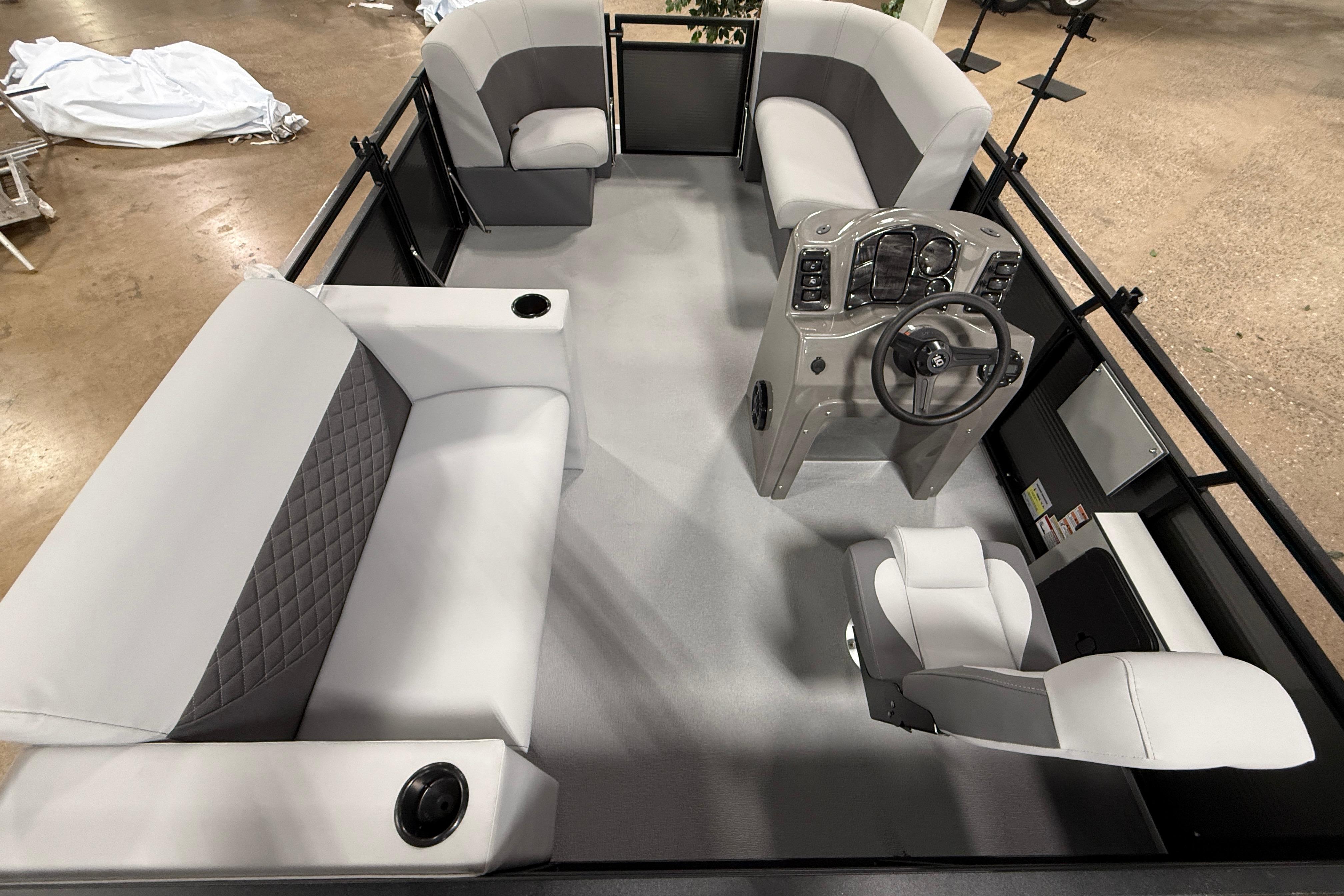 2026 Angler Quest 7515 Leisure Quest Cruise boat interior with modern seating and steering console.