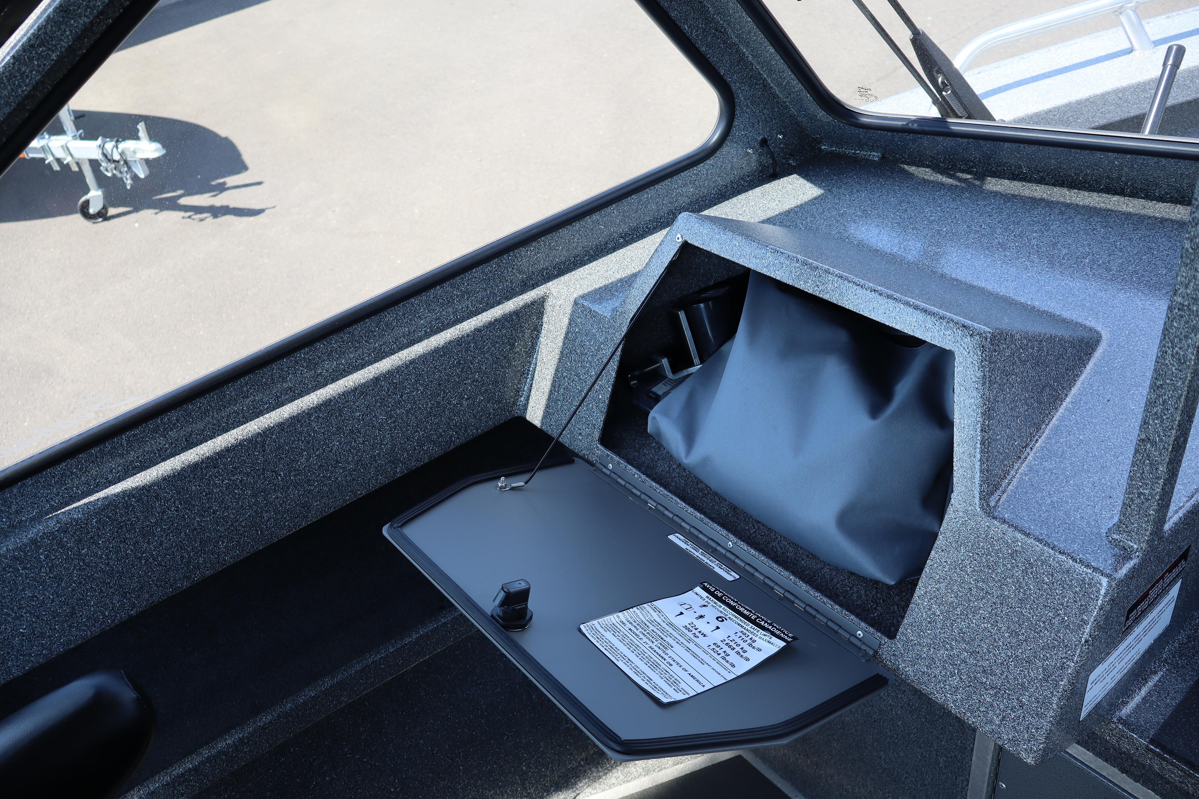 Interior view of 2025 NorthRiver SEAHAWK boat, featuring storage compartment and sleek design.
