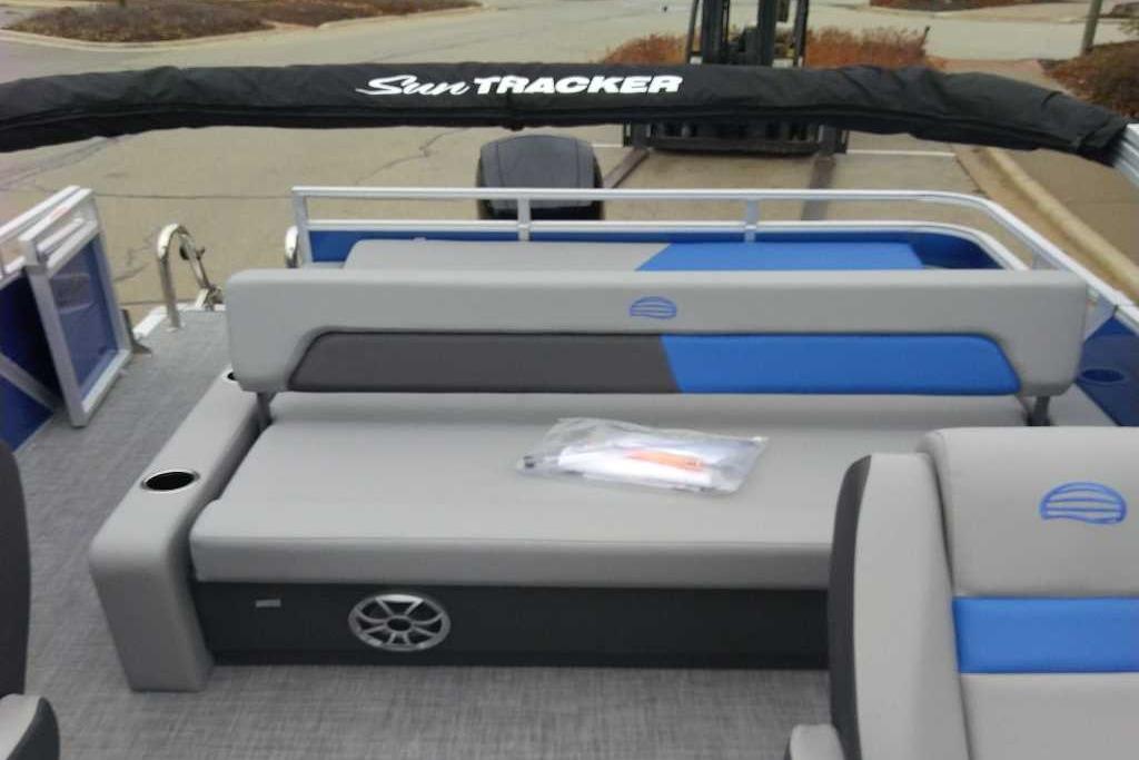 2026 Sun Tracker Party Barge 22 RF XP3 interior with gray and blue seating.