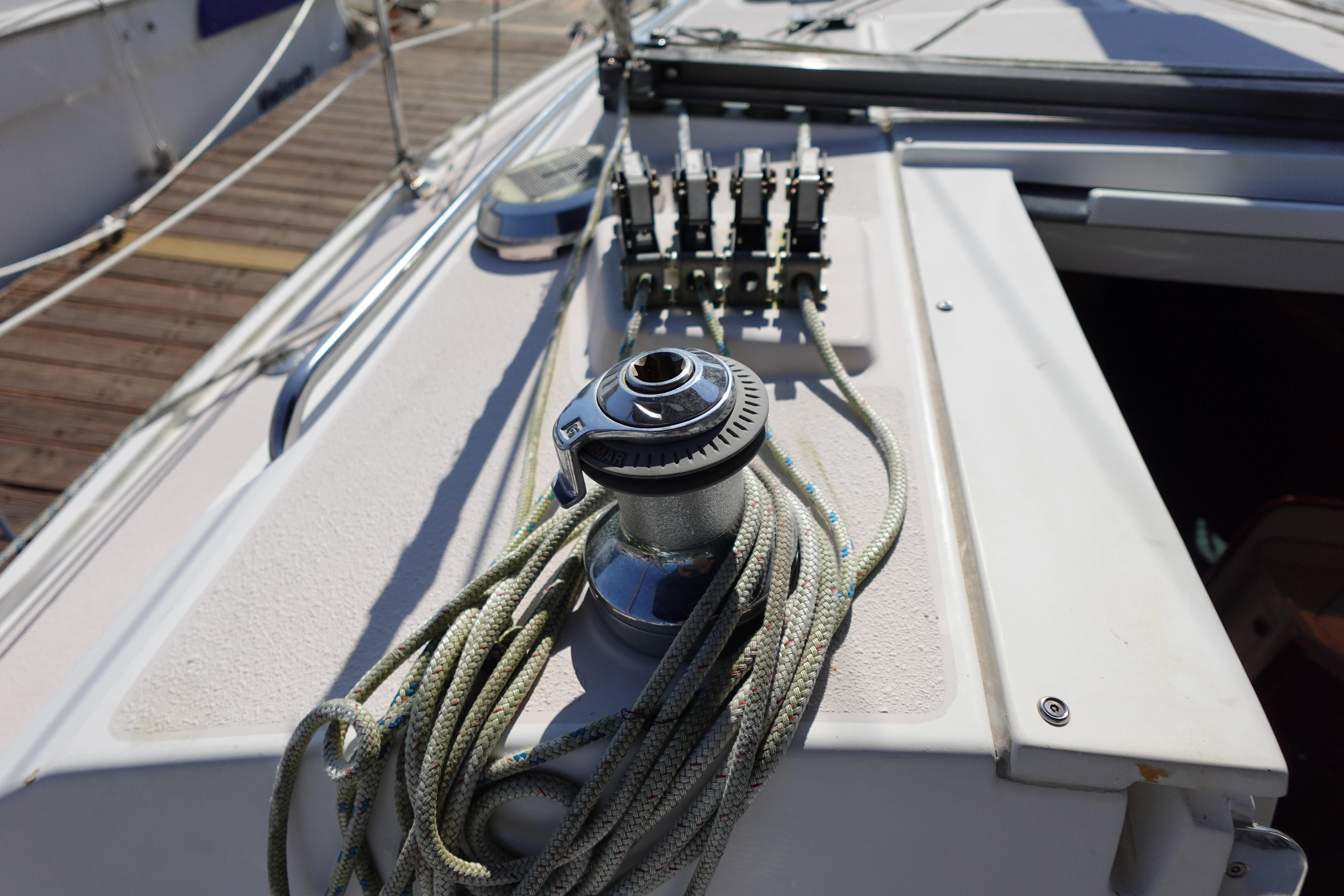 Deck of 1997 Catalina 28 sailboat with winch and ropes.