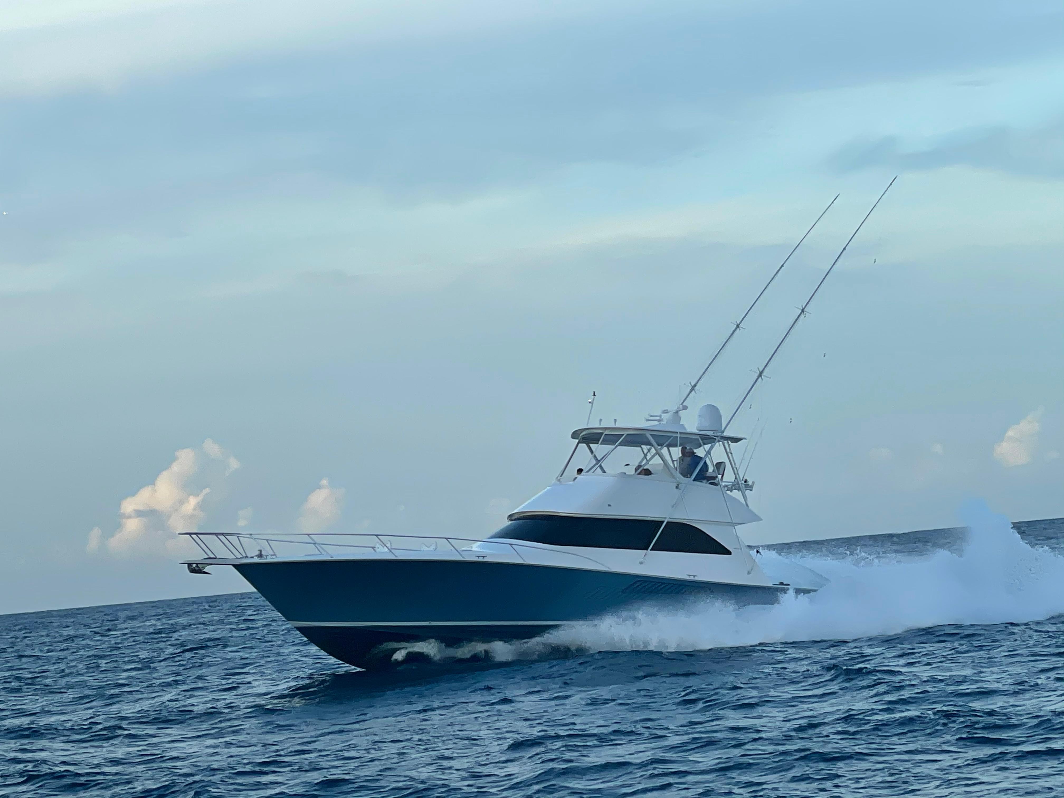 2007 Viking 52 Convertibles yacht cruising on open sea under clear sky.