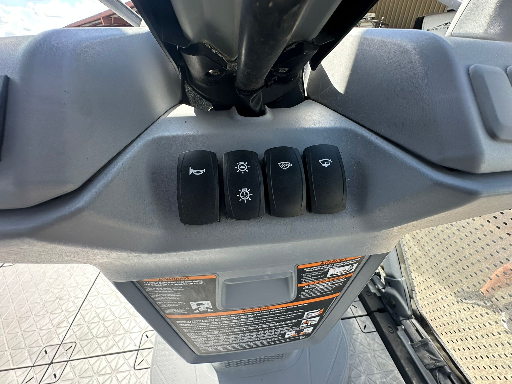 Close-up of a Sea-Doo 21 SWITCH SPORT control console with various switches.