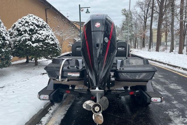 2026 Nitro Z19 XL boat with outboard motor in snowy setting.