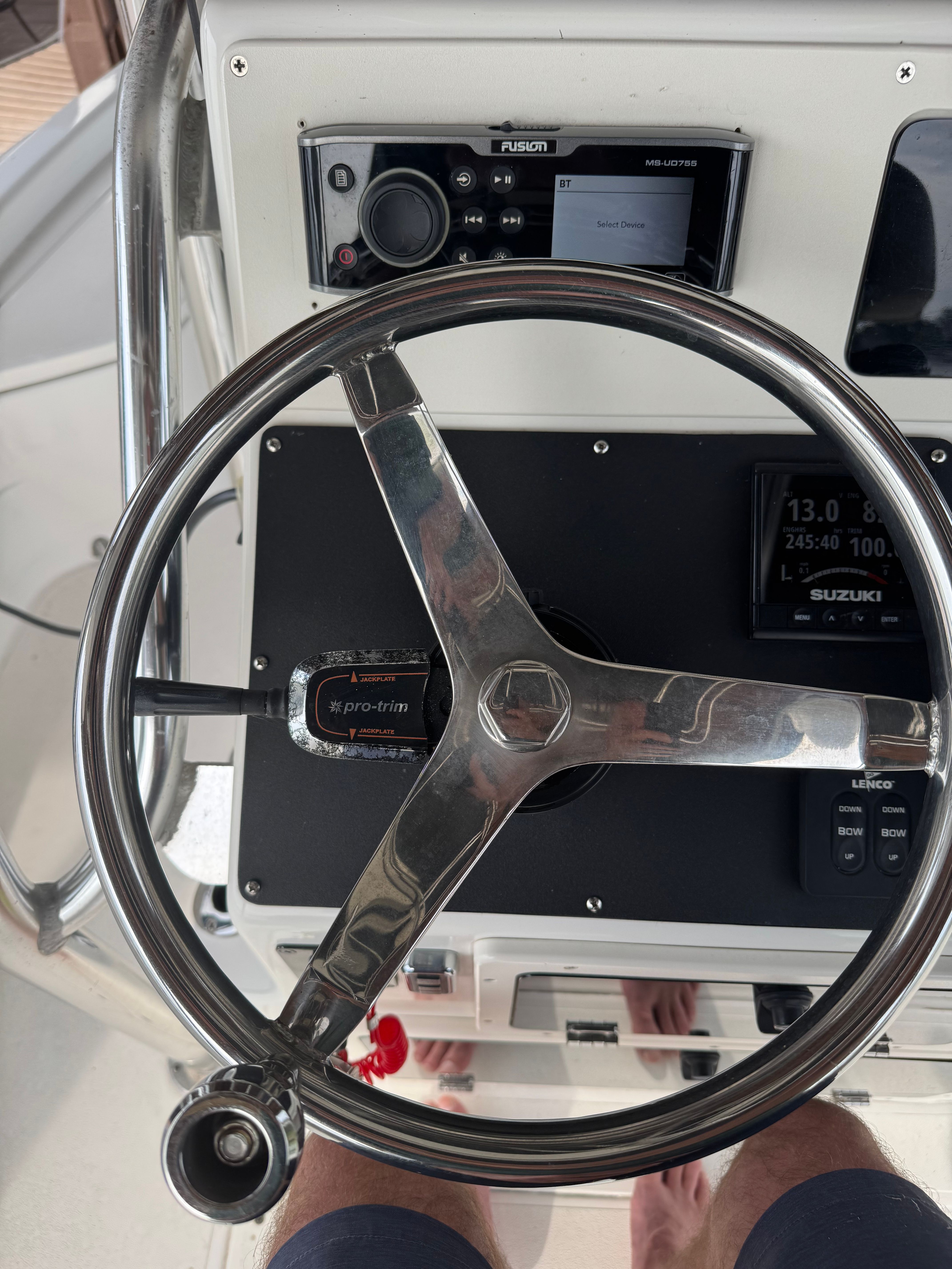 Steering wheel of a 2004 ShearWater LTZ boat with Fusion radio.
