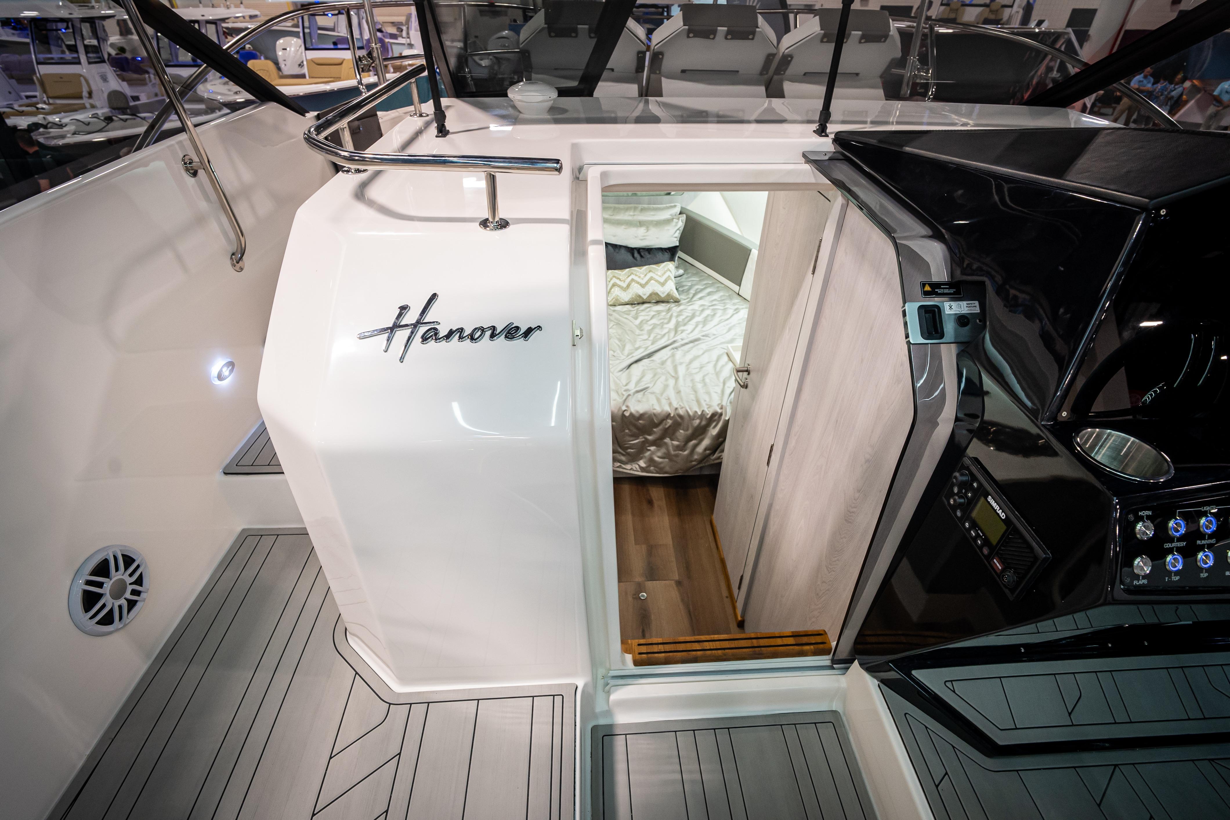 Interior view of 2026 Hanover 347 boat, featuring cabin entrance and sleek design.
