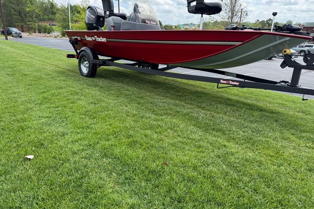 2026 Tracker Bass Tracker Classic XL boat on trailer, parked on grass.