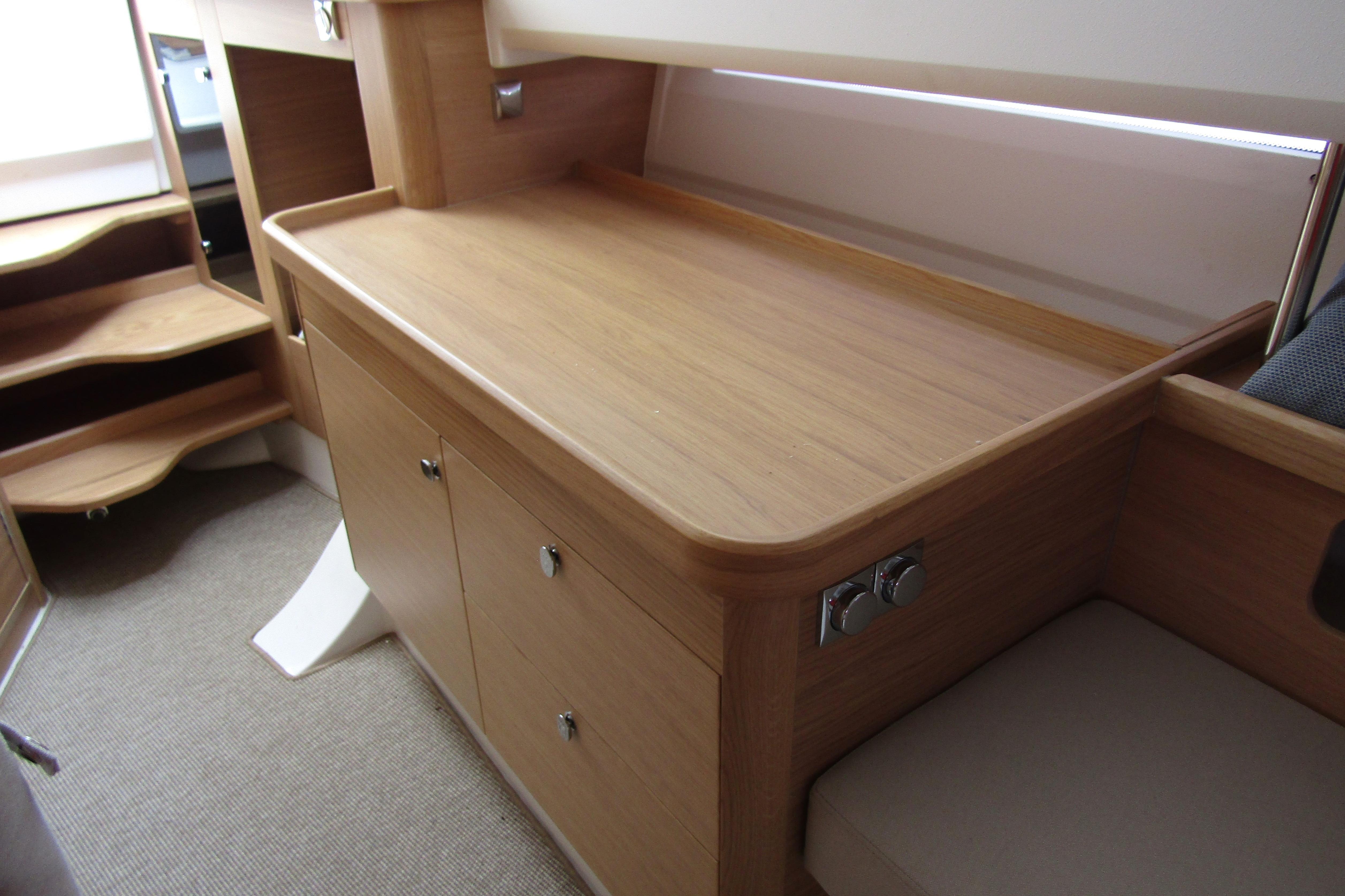 Interior of 2025 Nimbus Tender 11, featuring sleek wooden cabinetry and modern design.