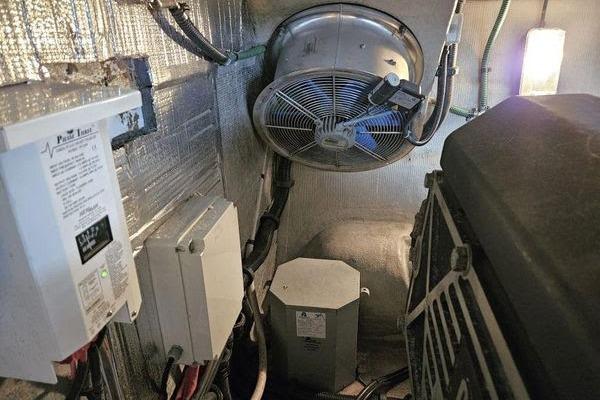 Engine room of a 2005 Sunseeker Manhattan 66 yacht, featuring electrical components and ventilation.