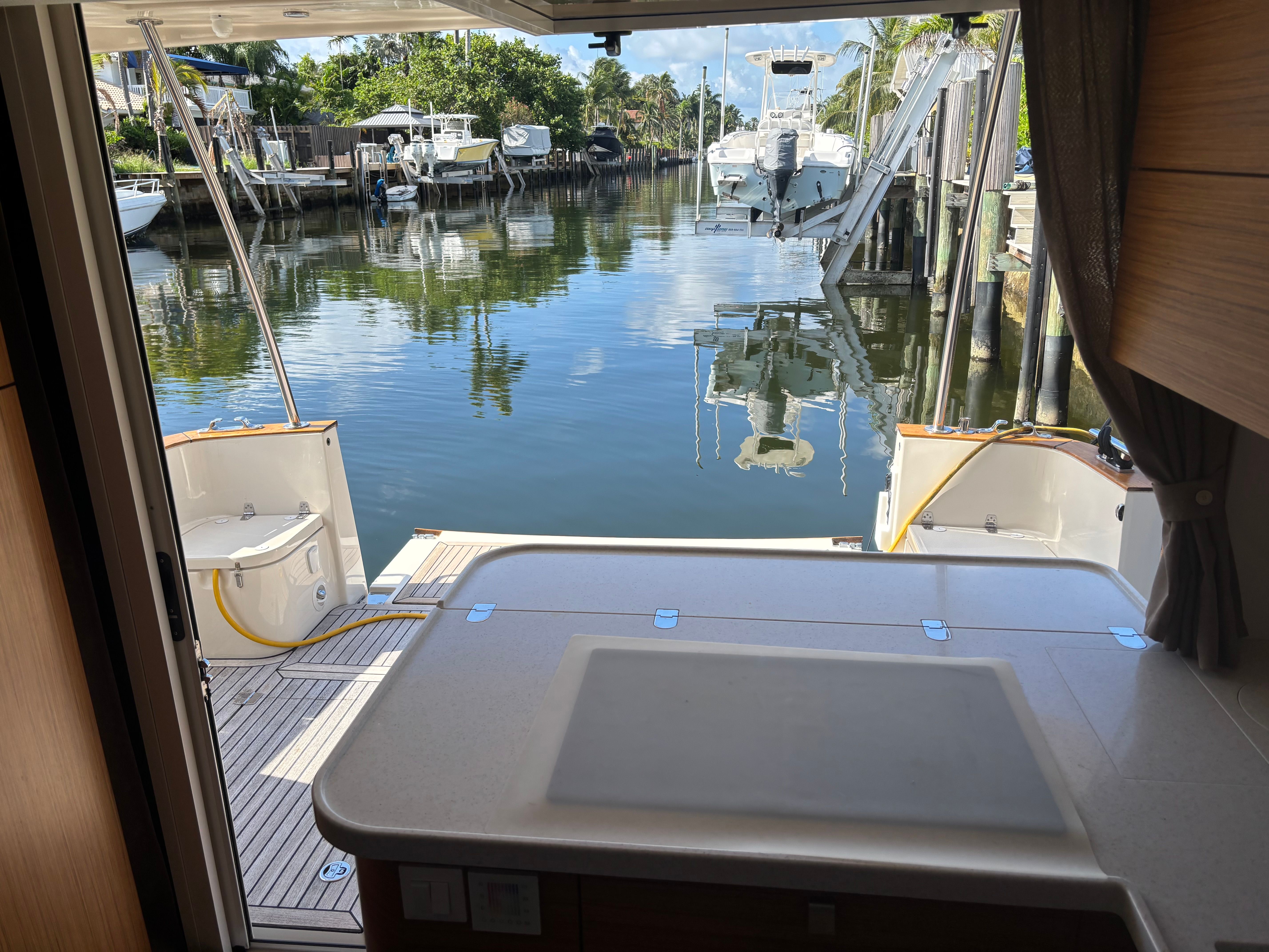 Interior view of a 2019 Greenline 40 yacht docked in a marina.