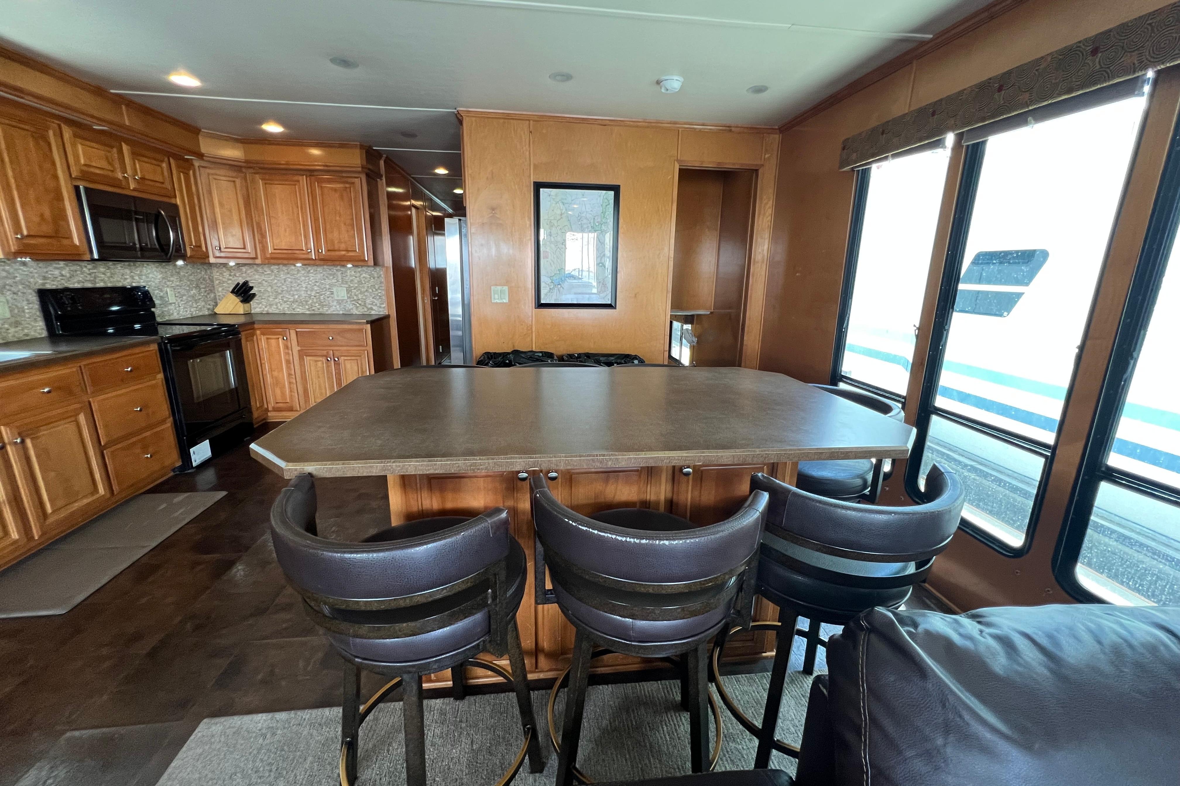 Luxurious 2013 Destination Yacht Lotta Yachta interior with kitchen and dining area.