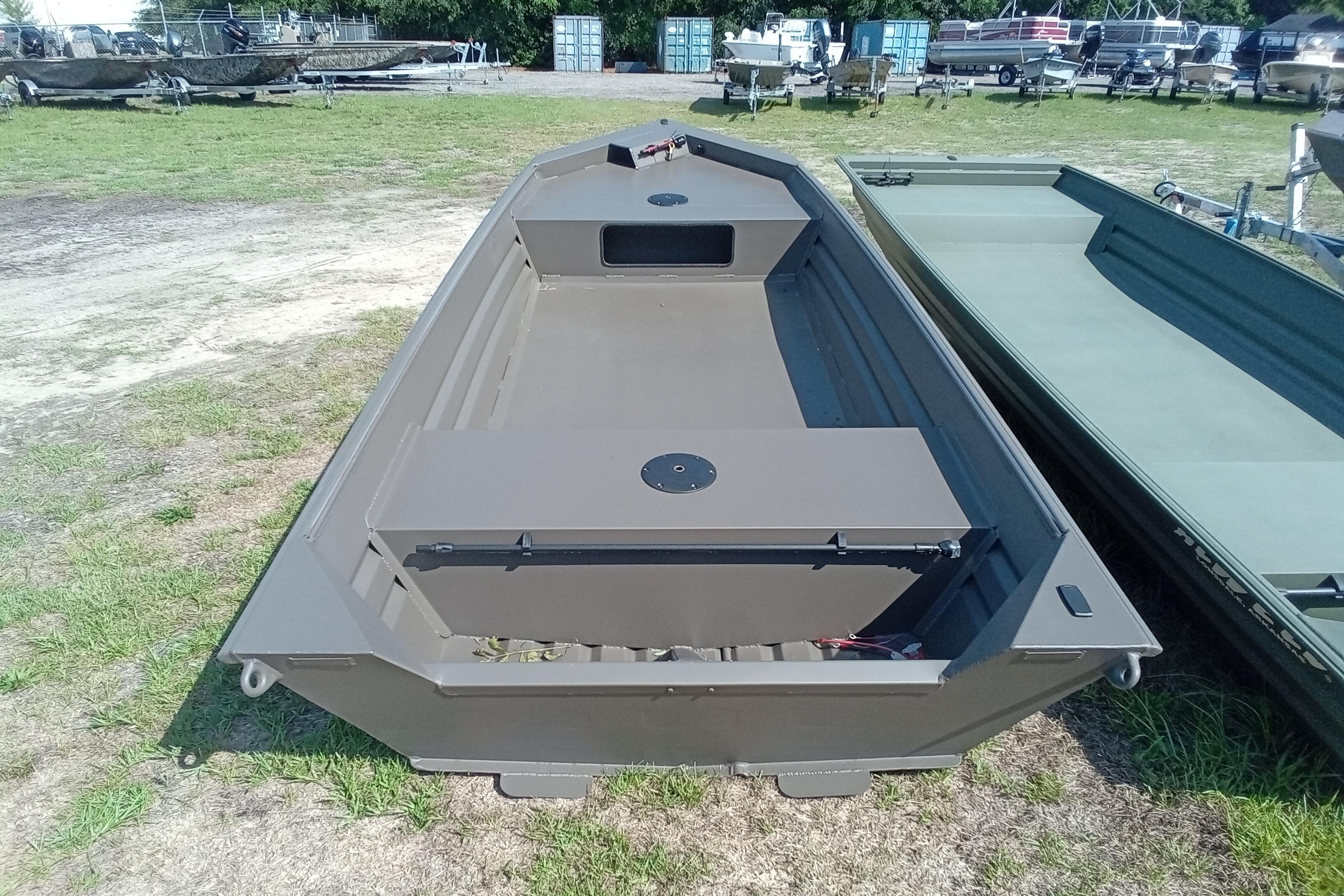 2026 Alweld 1548VV Marsh boat on grassy lot, showcasing spacious interior design.