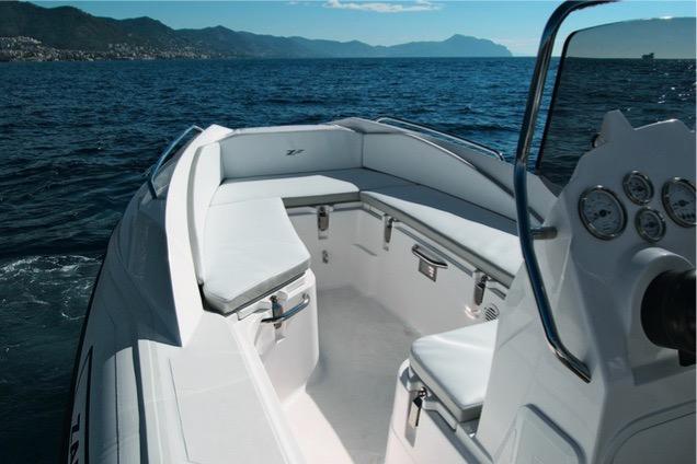 2024 Zar Formenti 49 SL boat interior with seating and ocean view.