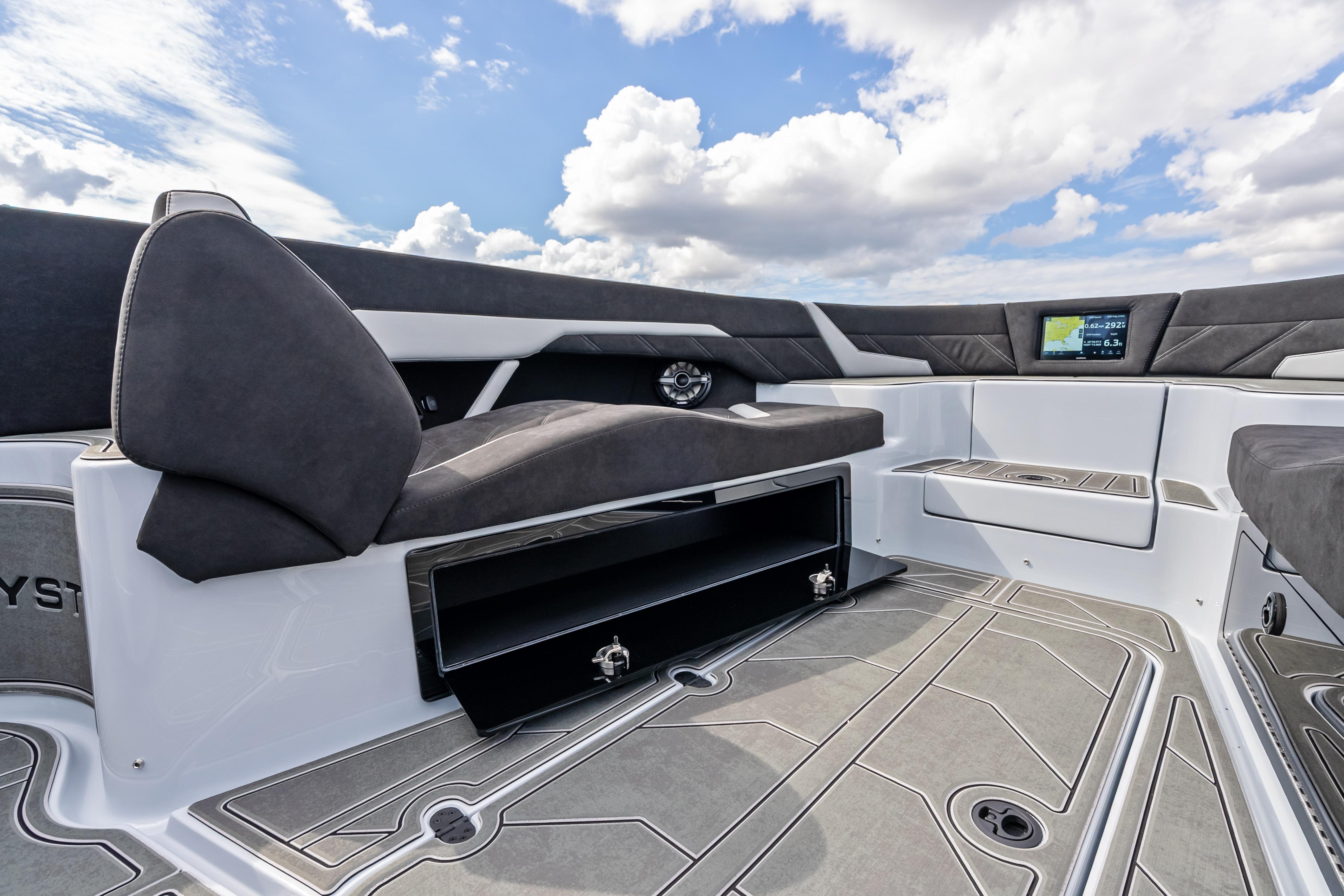 Interior of 2027 Mystic Powerboats M4200, featuring sleek seating and modern navigation display.