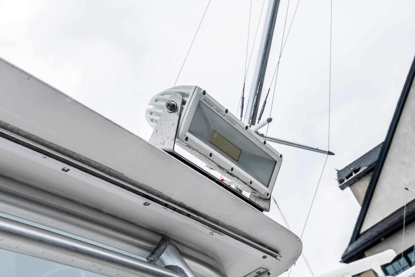 Close-up of a 2000 Viking 50' Convertible boat's radar equipment against a cloudy sky.