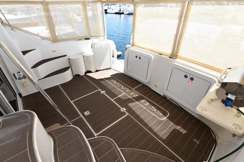 2008 Carver 43 Super Sport yacht interior with spacious deck and marina view.