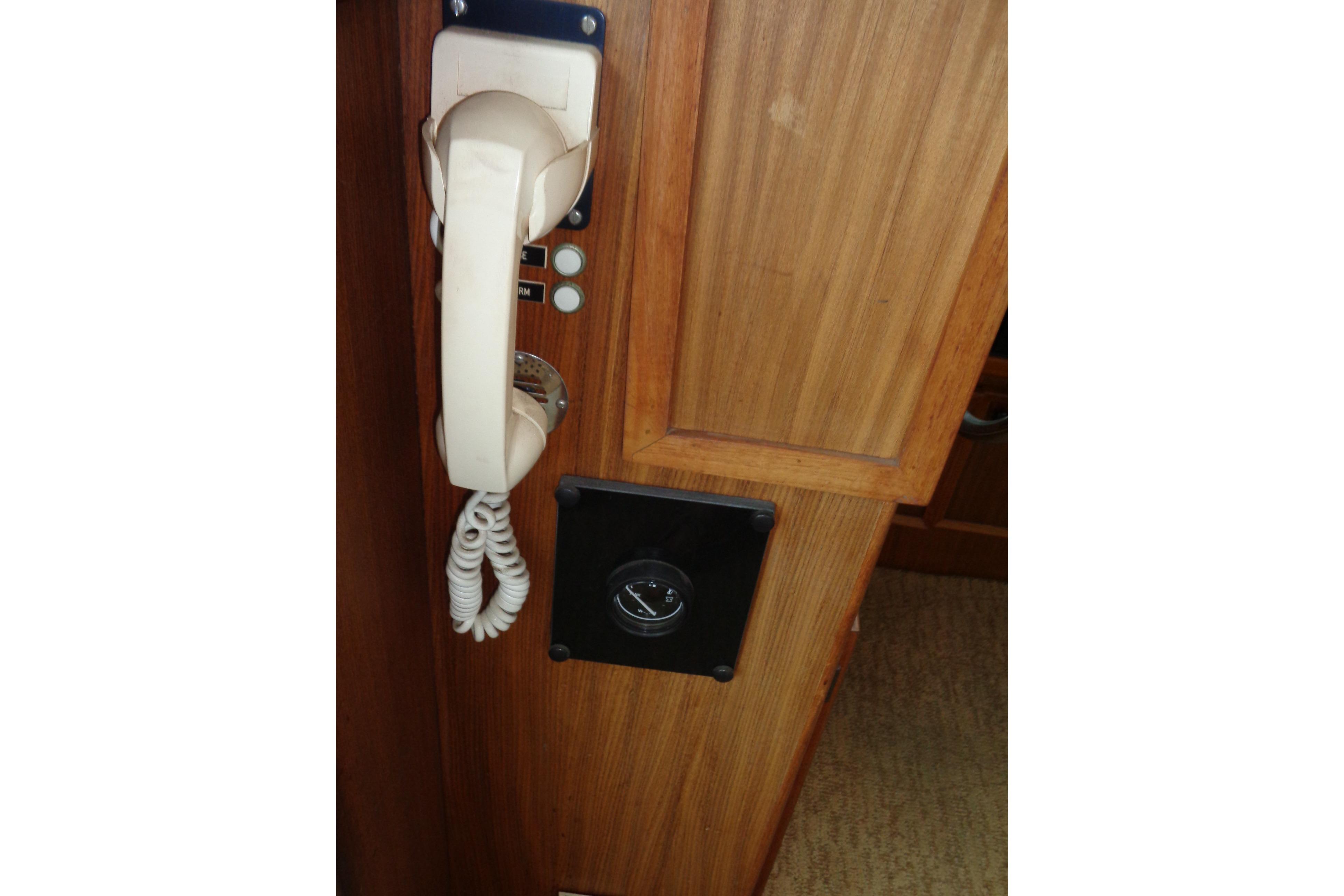 Vintage telephone on 1981 Hatteras 48 Cockpit Motor Yacht wooden interior.