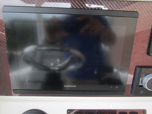 Garmin display on 2025 Solara S-250 CW dashboard with carbon fiber finish.