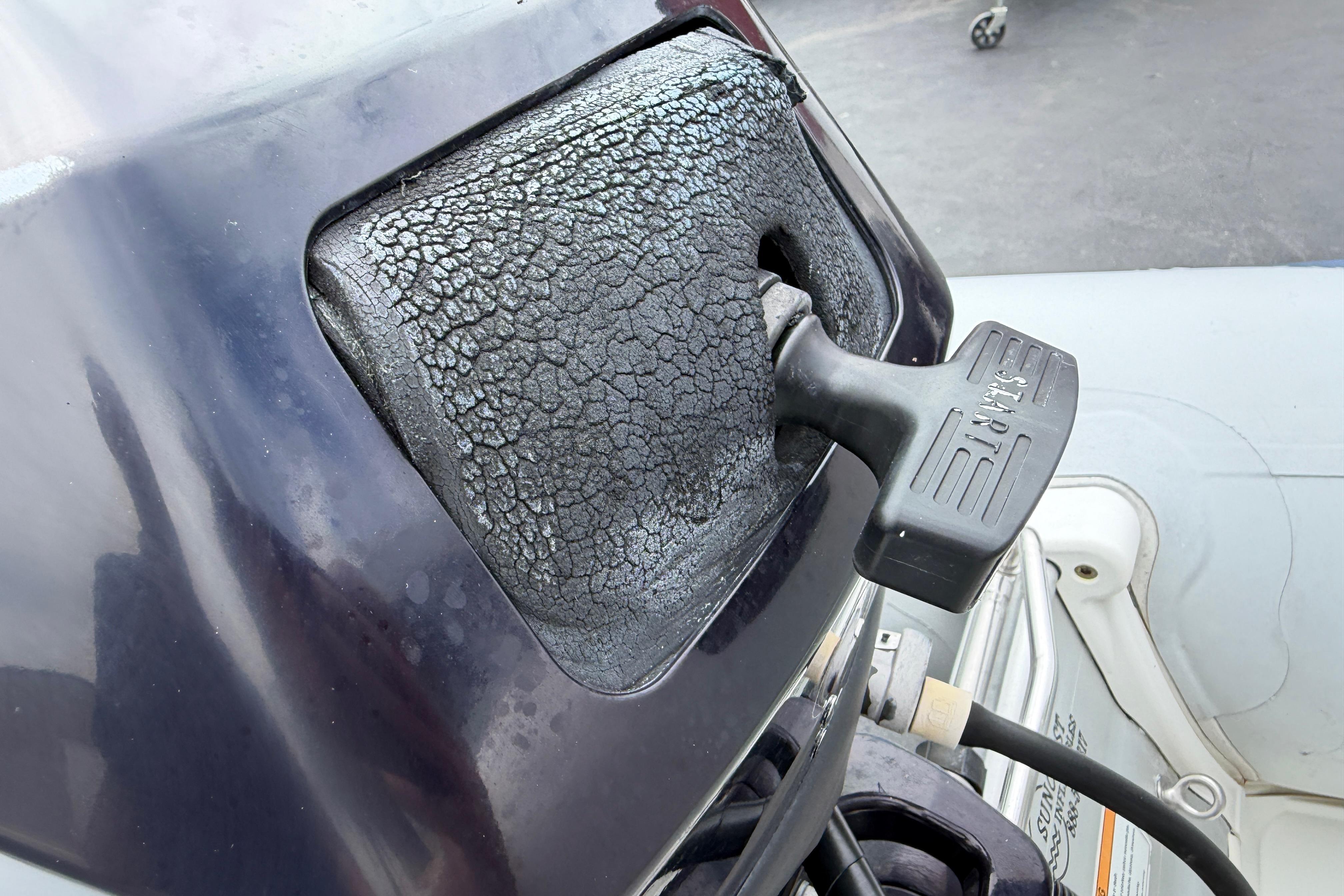 Cracked engine cover on 2017 Walker Bay Genesis G2 340DX Console boat.