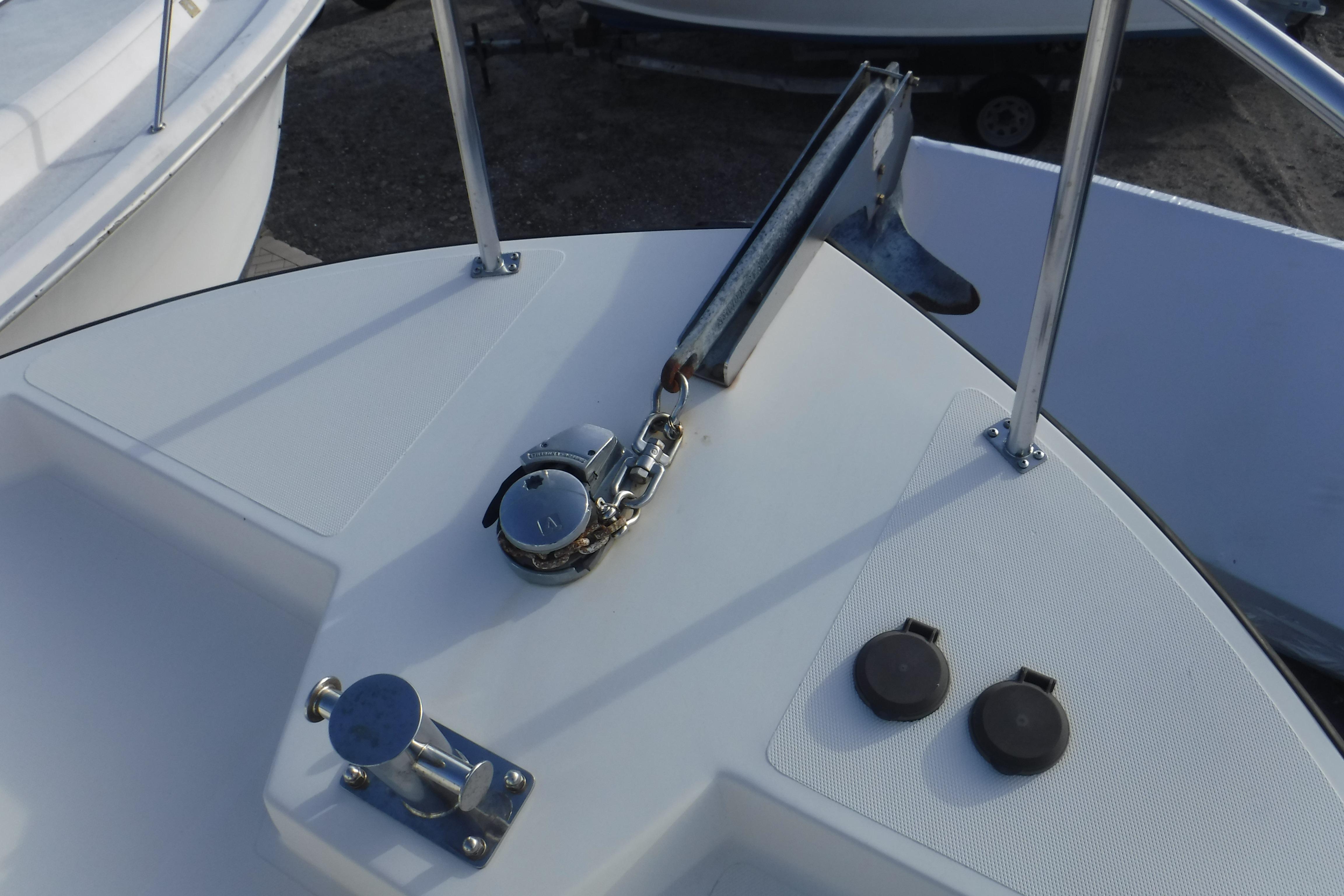Bow of a 2002 Nordic Tug 37 with anchor and deck fittings.