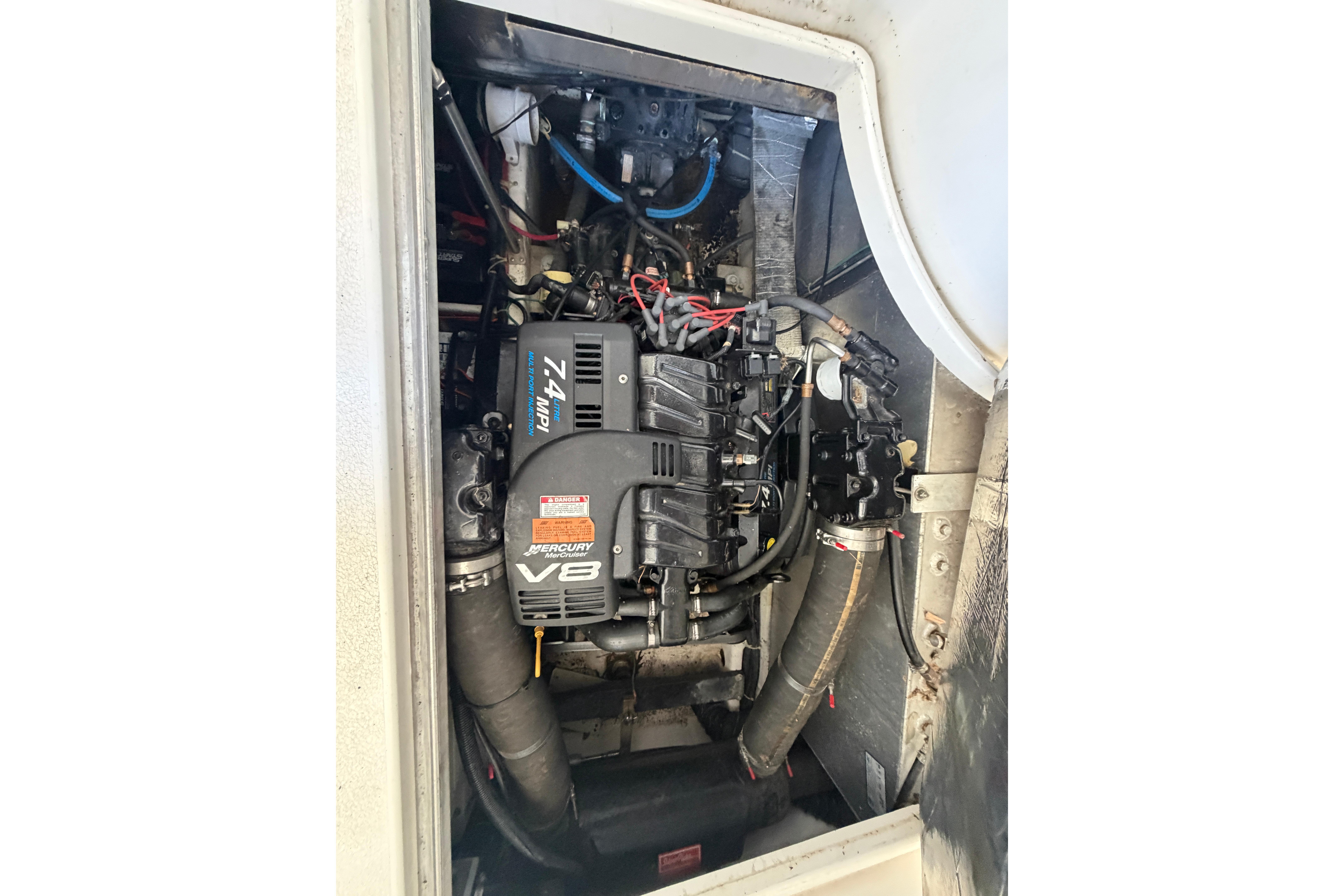 Engine compartment of a 2000 Carver 350 Mariner with a Mercury Marine V8 engine.