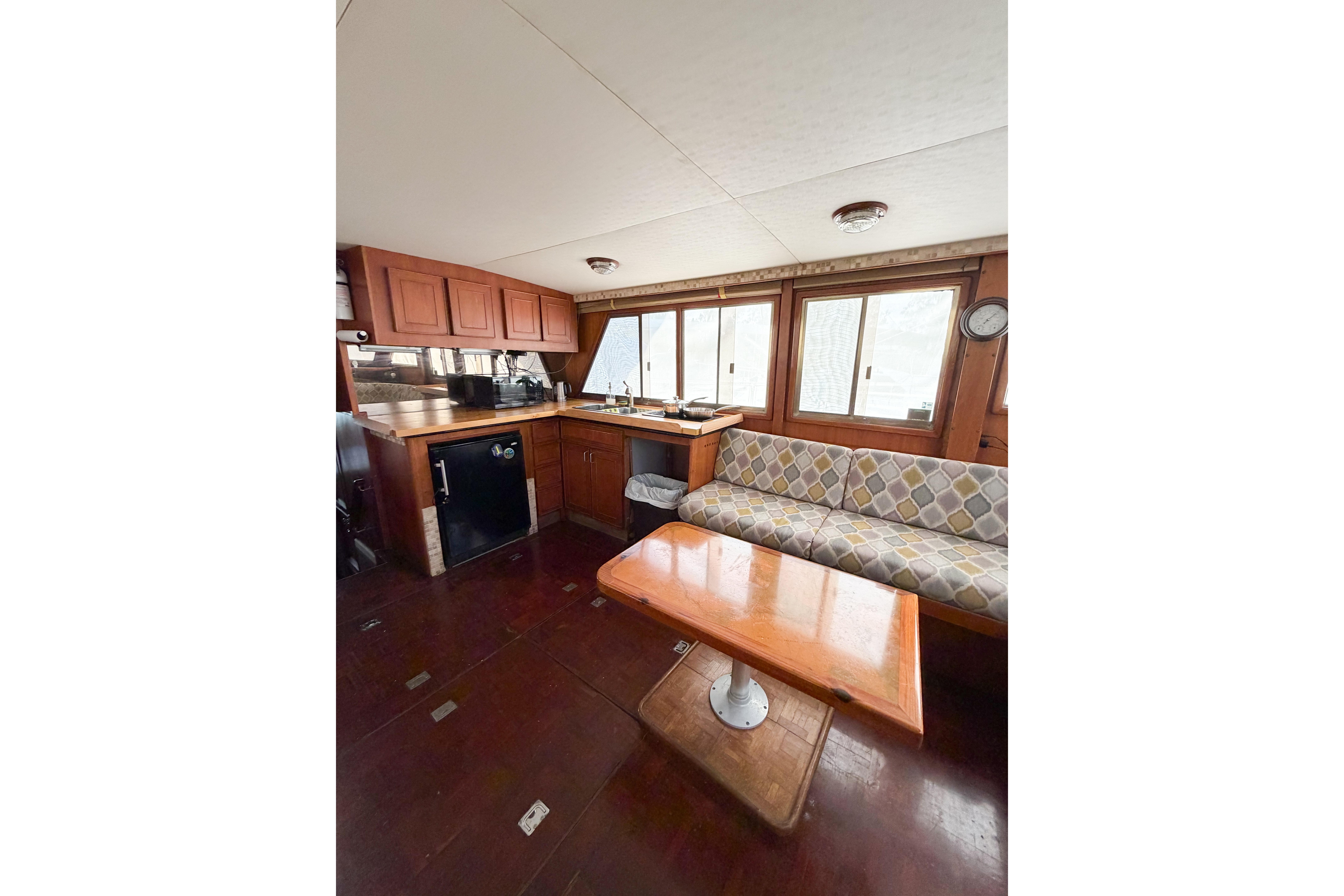 Interior of 1989 Jefferson Marquessa 52 yacht with kitchen and seating area.