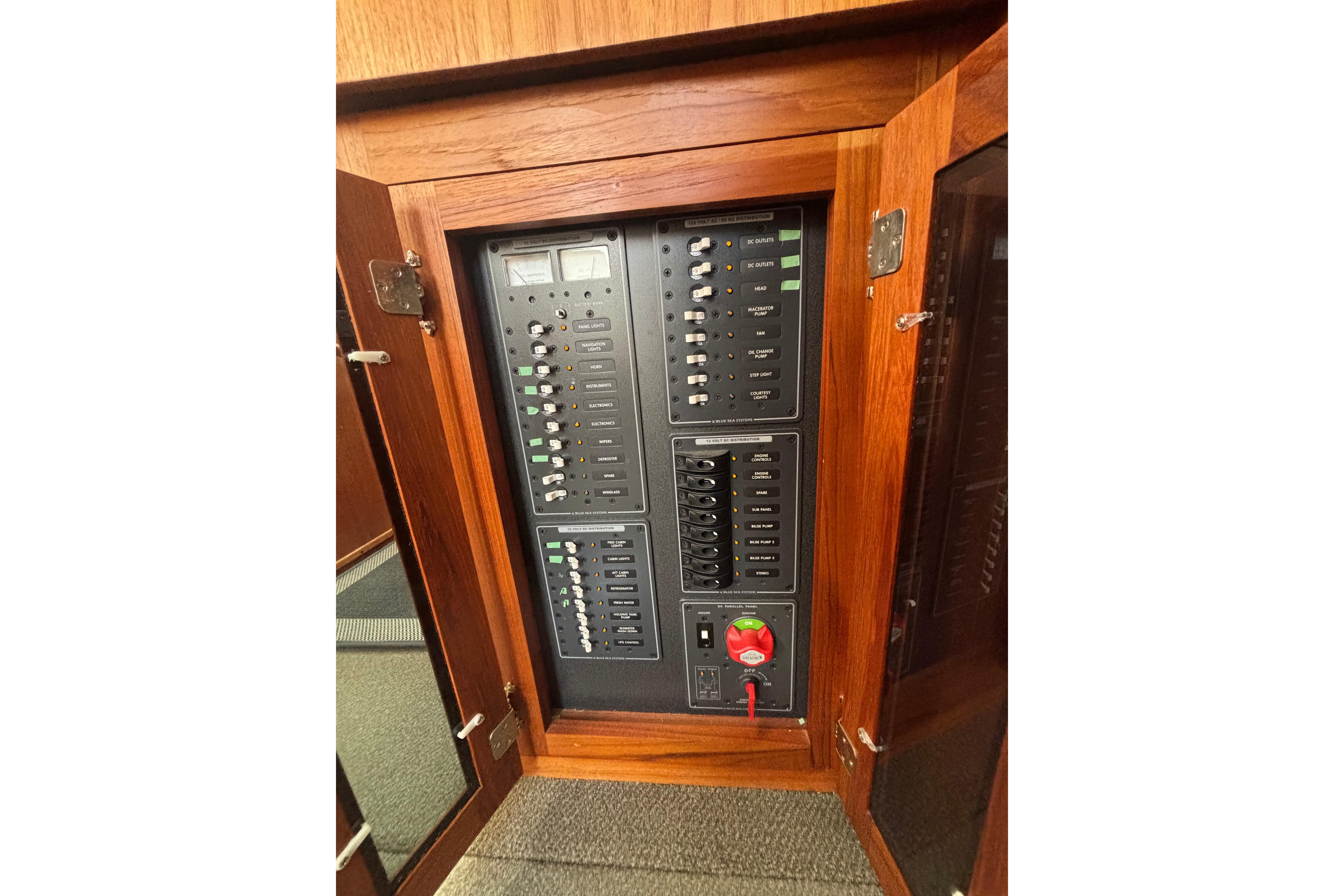 Electrical panel inside a 2004 Nordic Tug 37, featuring switches and gauges.