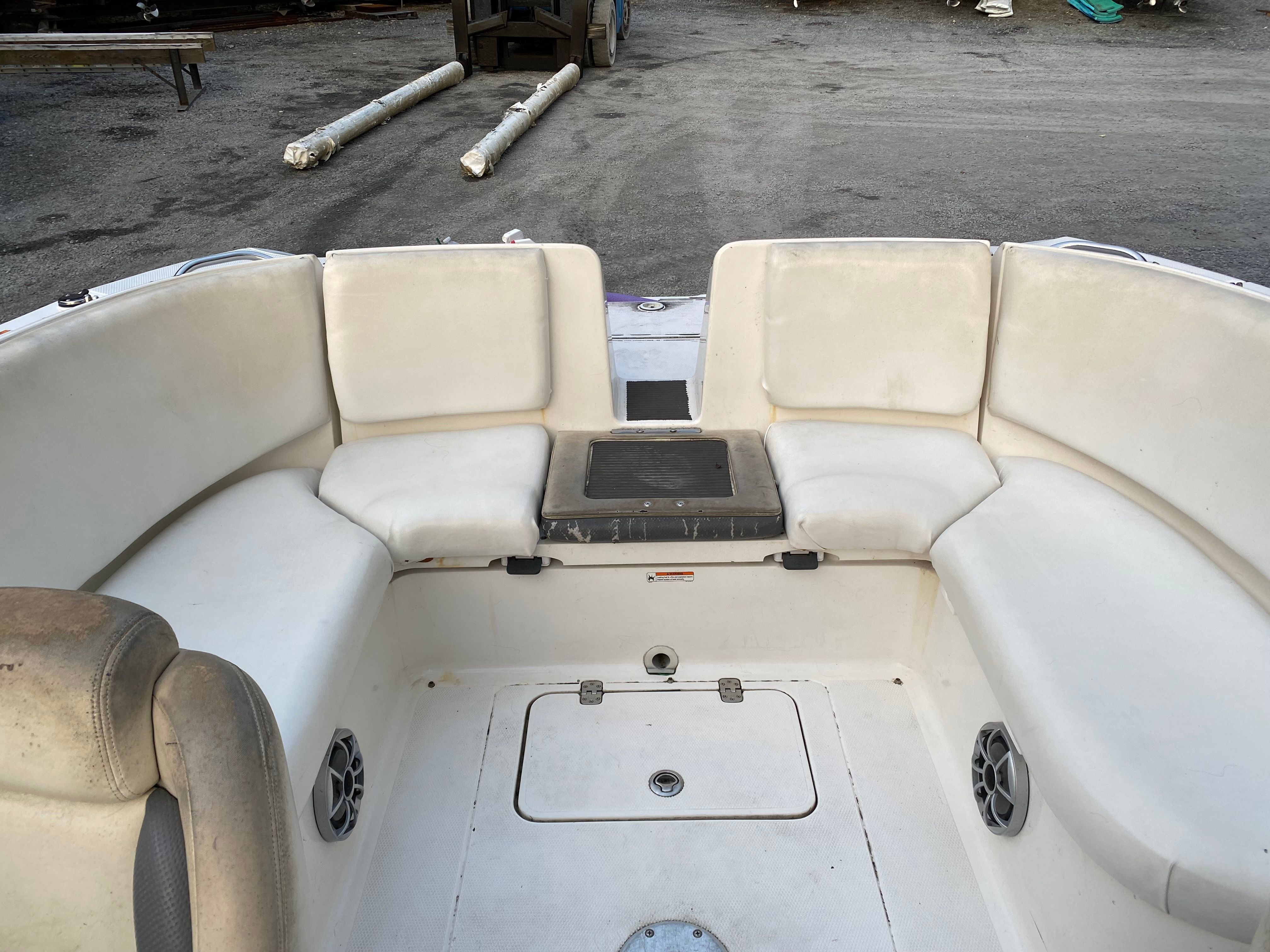 Interior of a 2005 Yamaha SX230 HO boat with white seating.