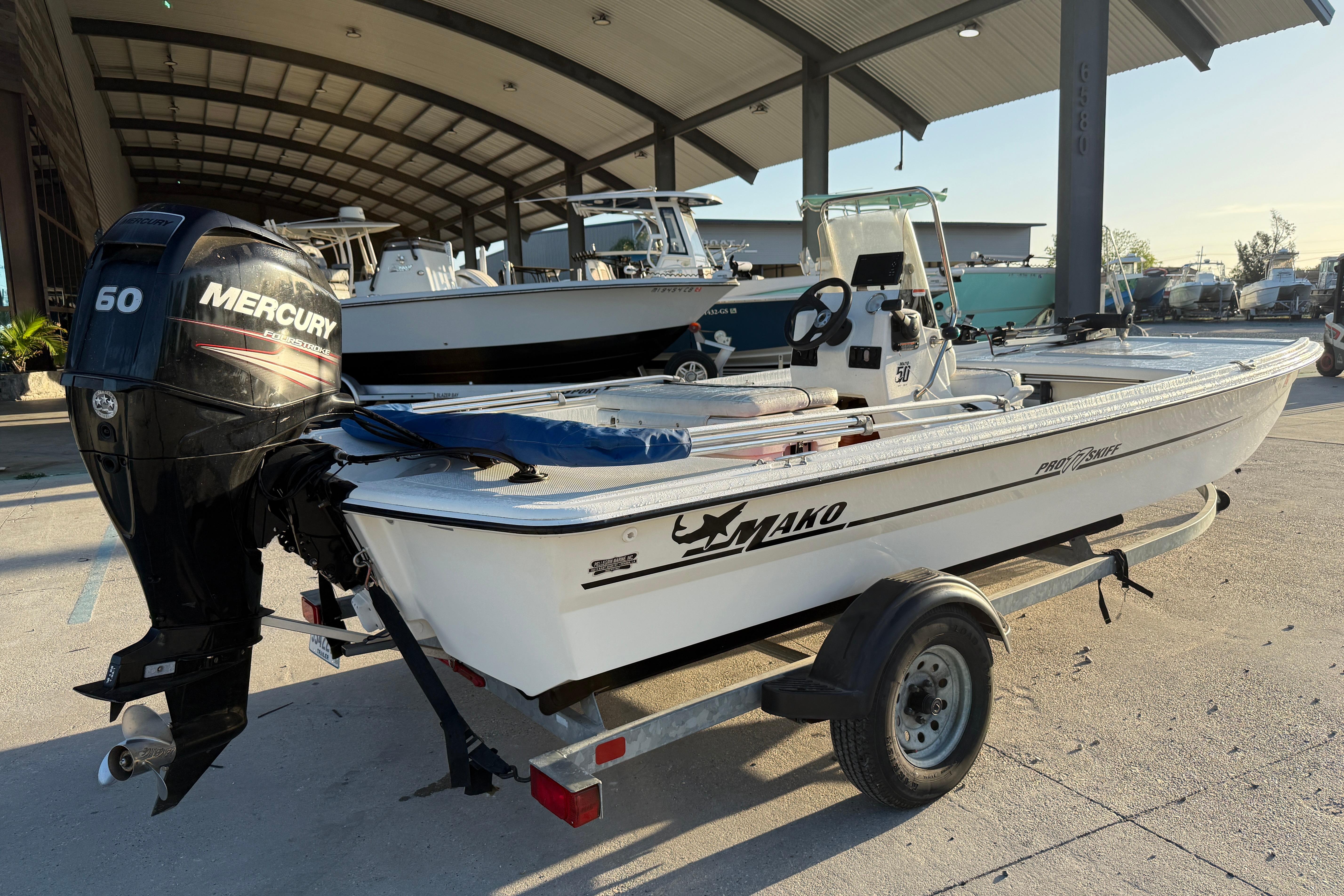 2017 Mako Pro Skiff 17 CC boat with Mercury 60 engine on trailer.